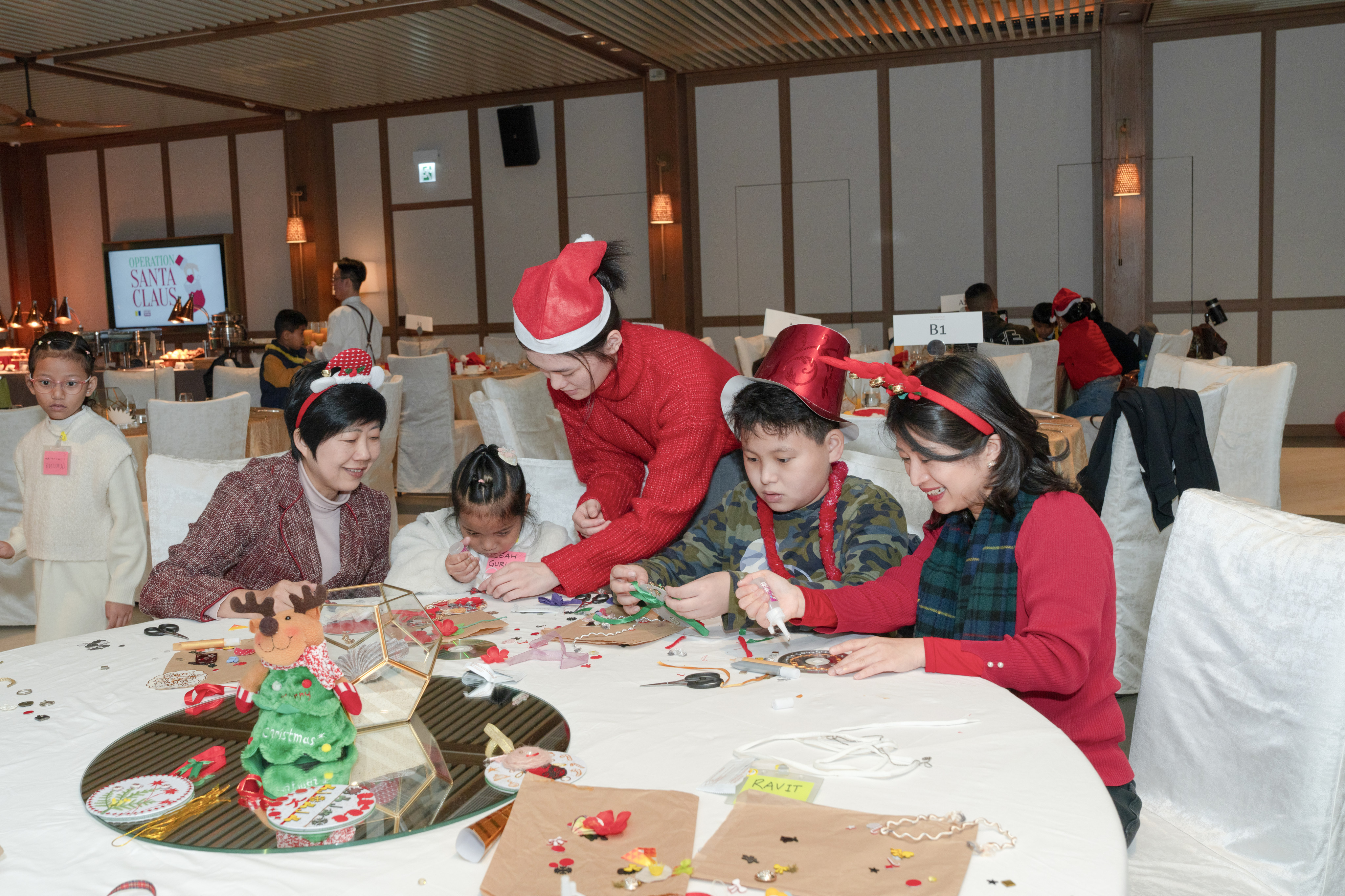 Attendees take part in workshops to create their own Christmas decorations. Photo:  Eboham Liga