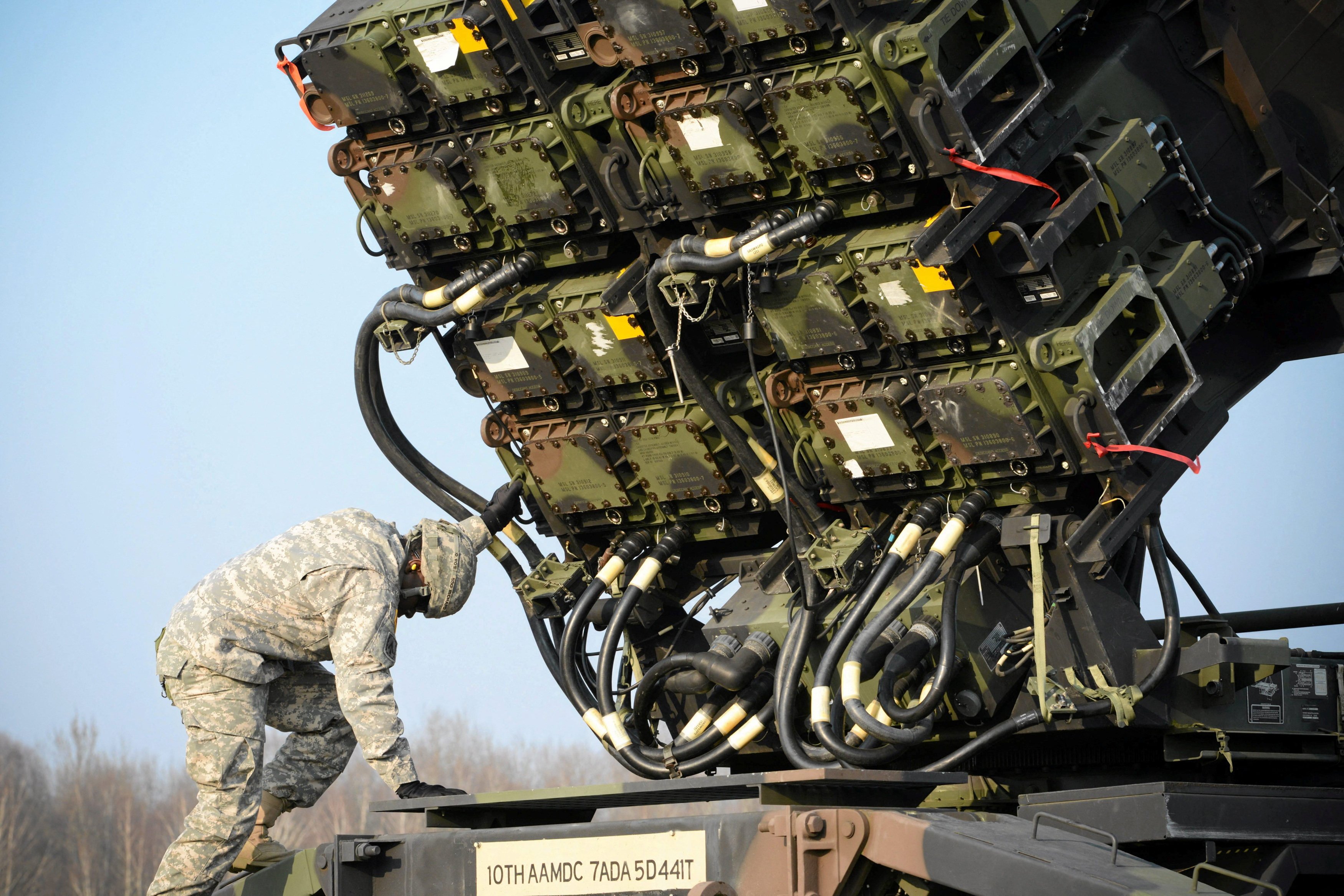 A US soldier inspects a Patriot missile defence battery during join exercises at military grounds in Sochaczew, near Warsaw. The government is planning to sell PAC-2 and some more advanced PAC-3 interceptors made in Japan to the US, according to officials who asked not to be identified. Photo: Reuters