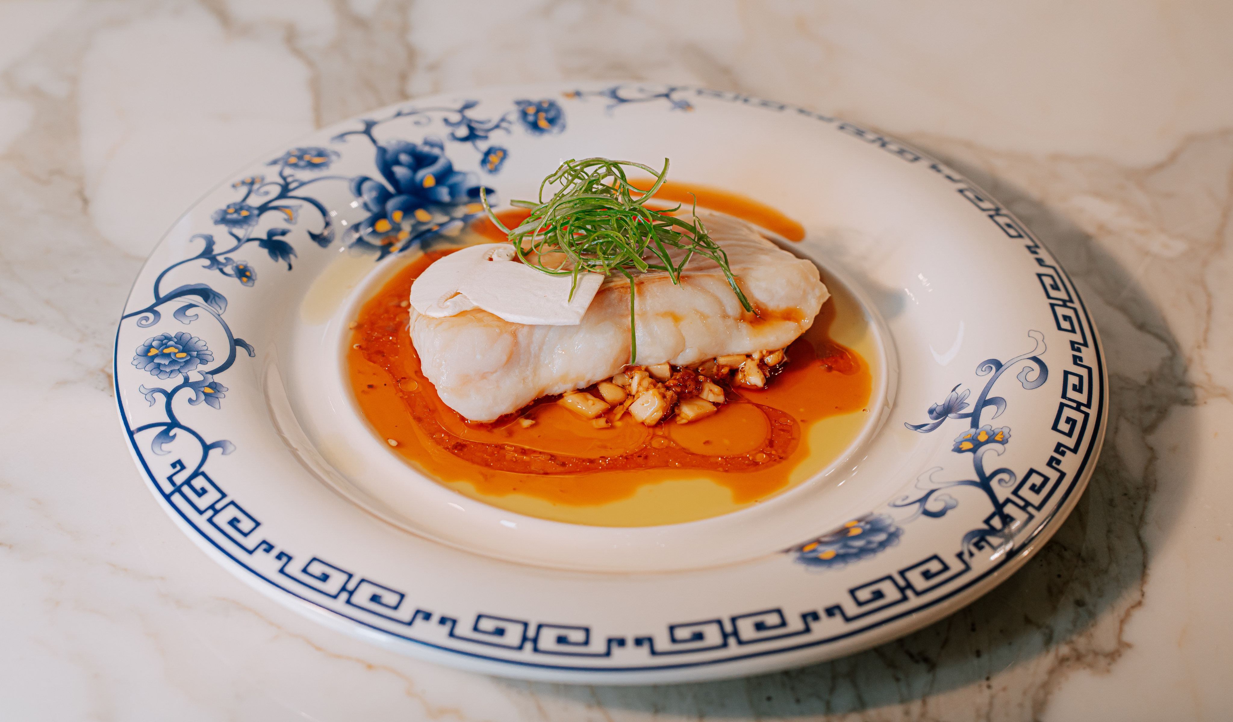 Steamed ling cod, Matsutake soy, chives and peppercorn served as part of the dinner at Beijing Mansion, a luxurious private members’ club designed in the style of a traditional Chinese siheyuan, or courtyard house, and the only one of its kind in Canada. Photo: William Luk and Joon Rho