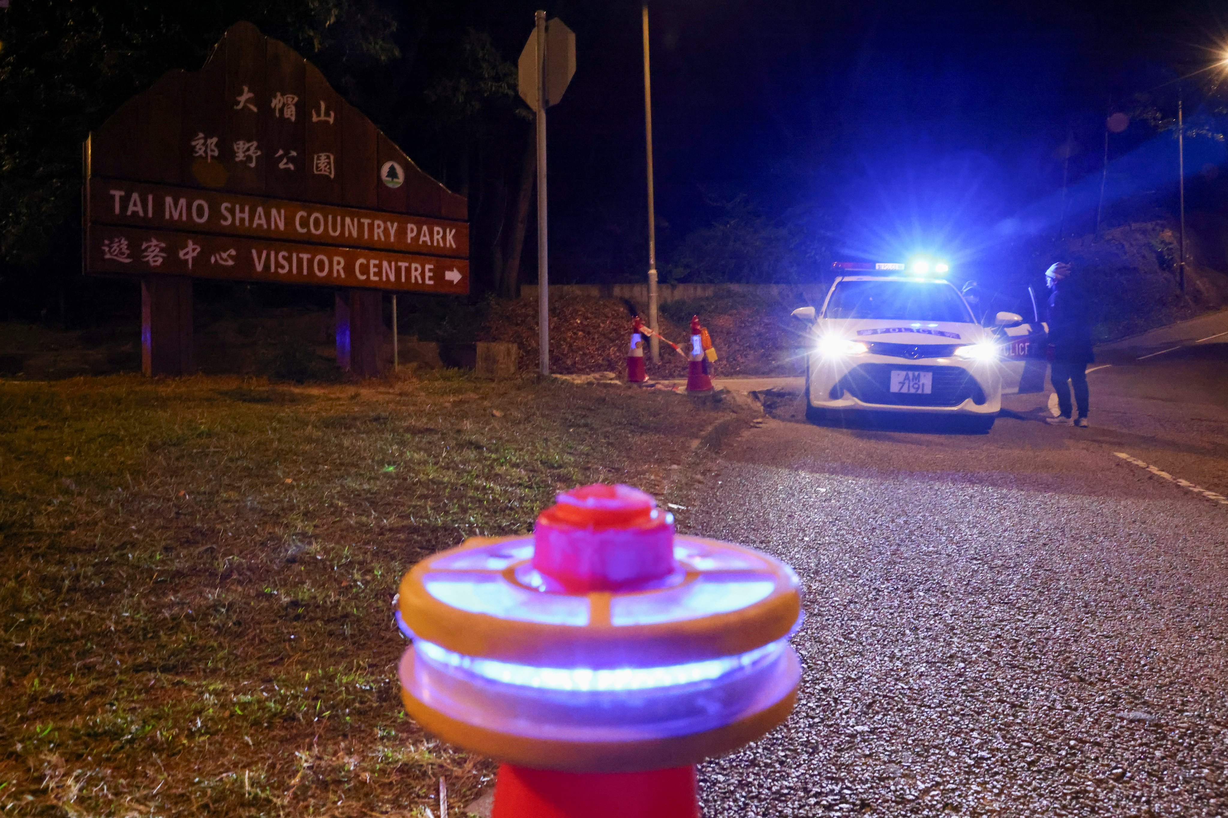 A police car at Tai Mo Shan. The missing hiker last spoke to officers around 4pm on Thursday. Photo: Dickson Lee