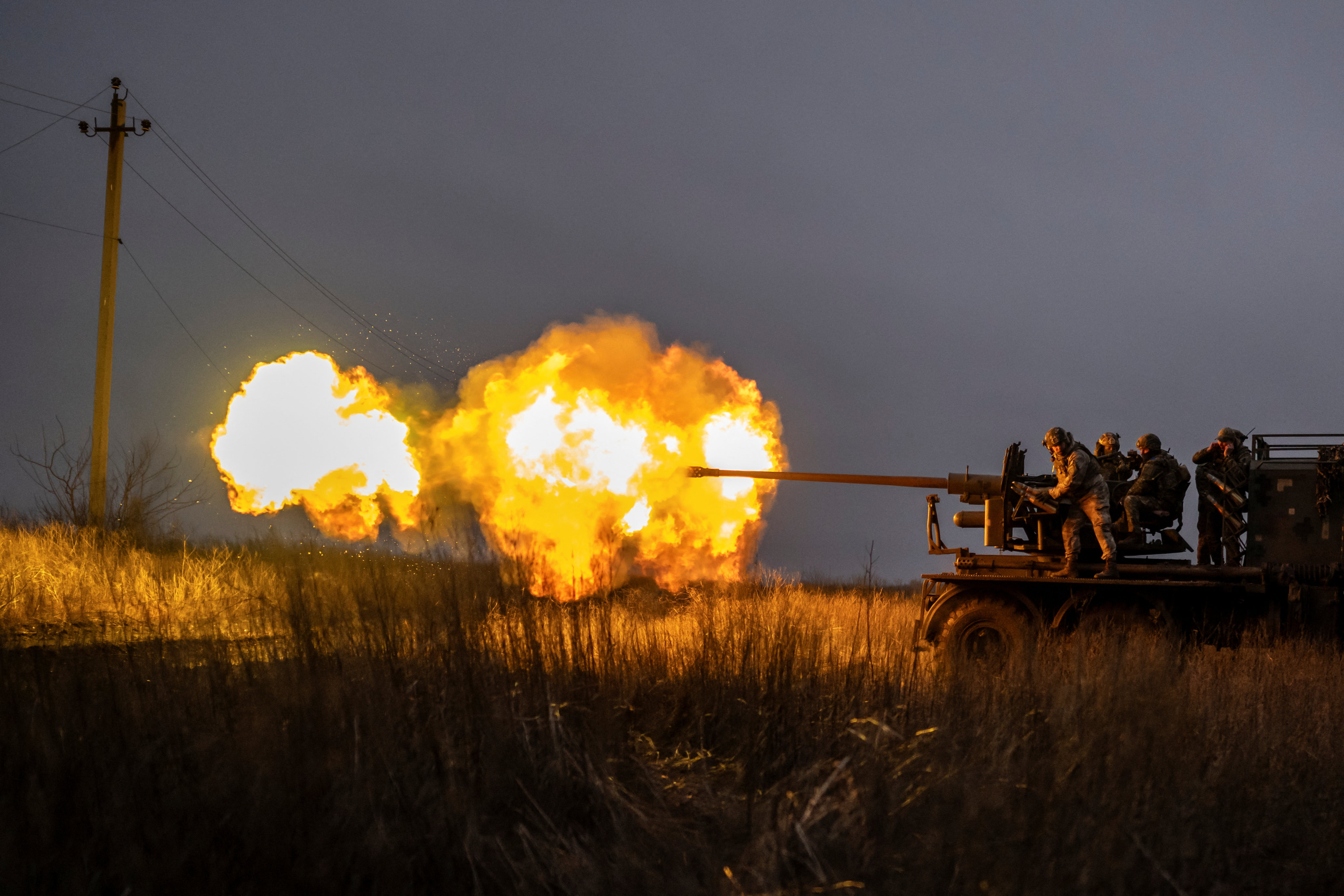 Ukrainian soldiers fire a С60 cannon towards Russian troops near the town of Bakhmut on Thursday. Photo: Reuters