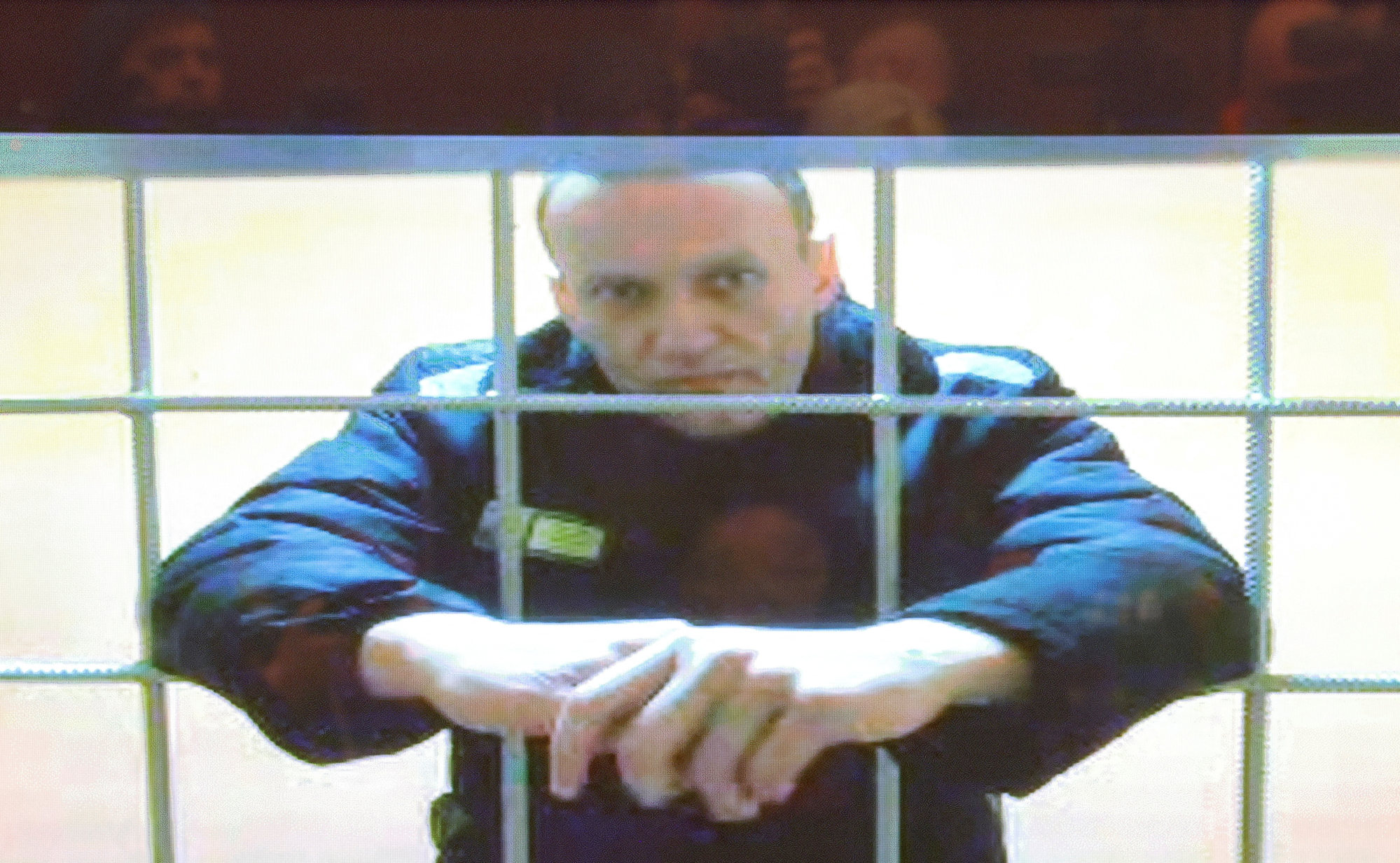 Russian opposition leader Alexei Navalny is seen on a screen via a video link from acorrective penal colony in Pokrov during a court hearing to consider an appeal against his prison sentence in May 2022. Photo: Reuters