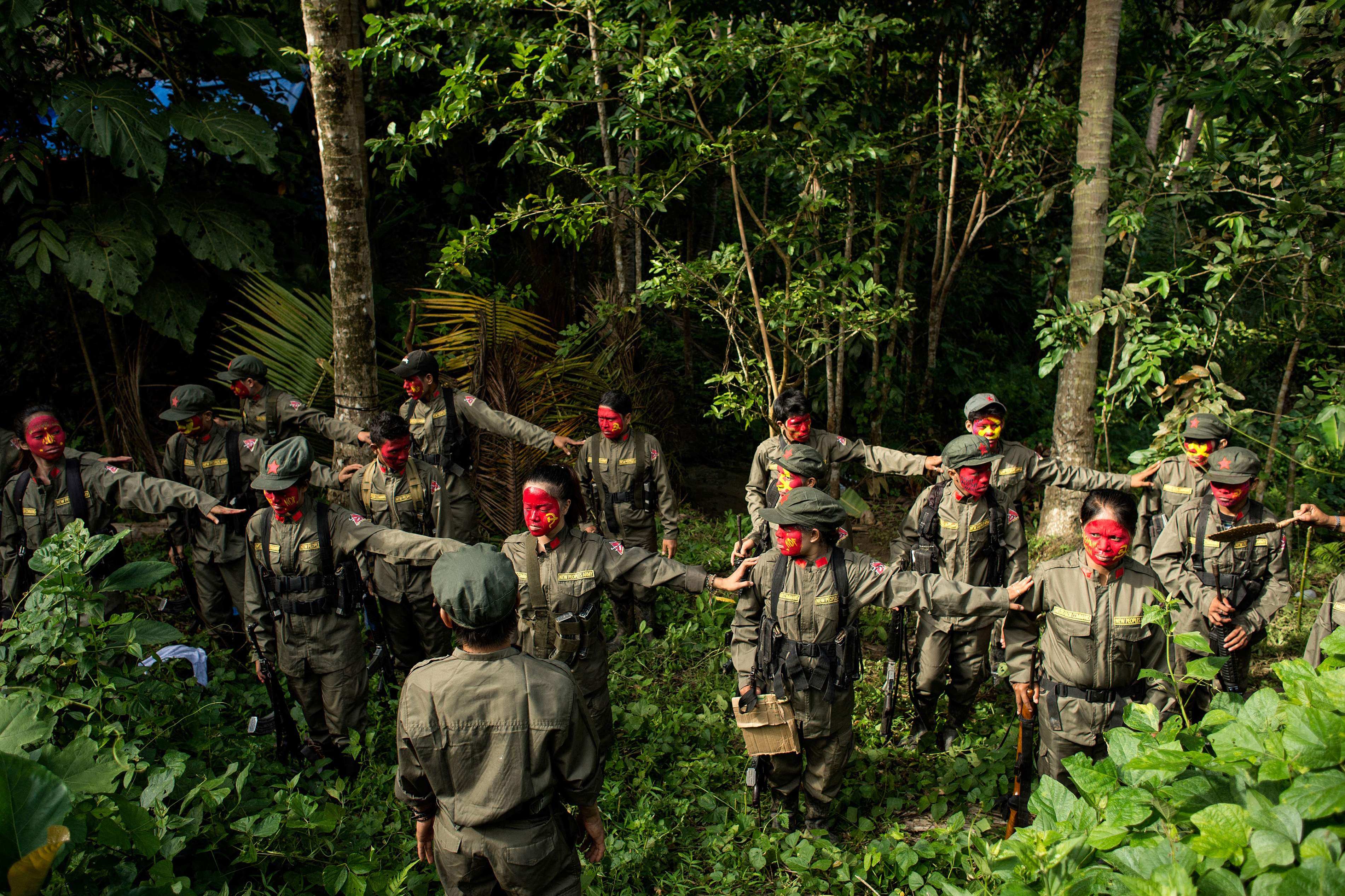 Communist rebels of the New People’s Army stand in formation in the Sierra Madre mountain range. Philippine troops killed nine communist rebels in a series of firefights on December 25. Photo: AFP