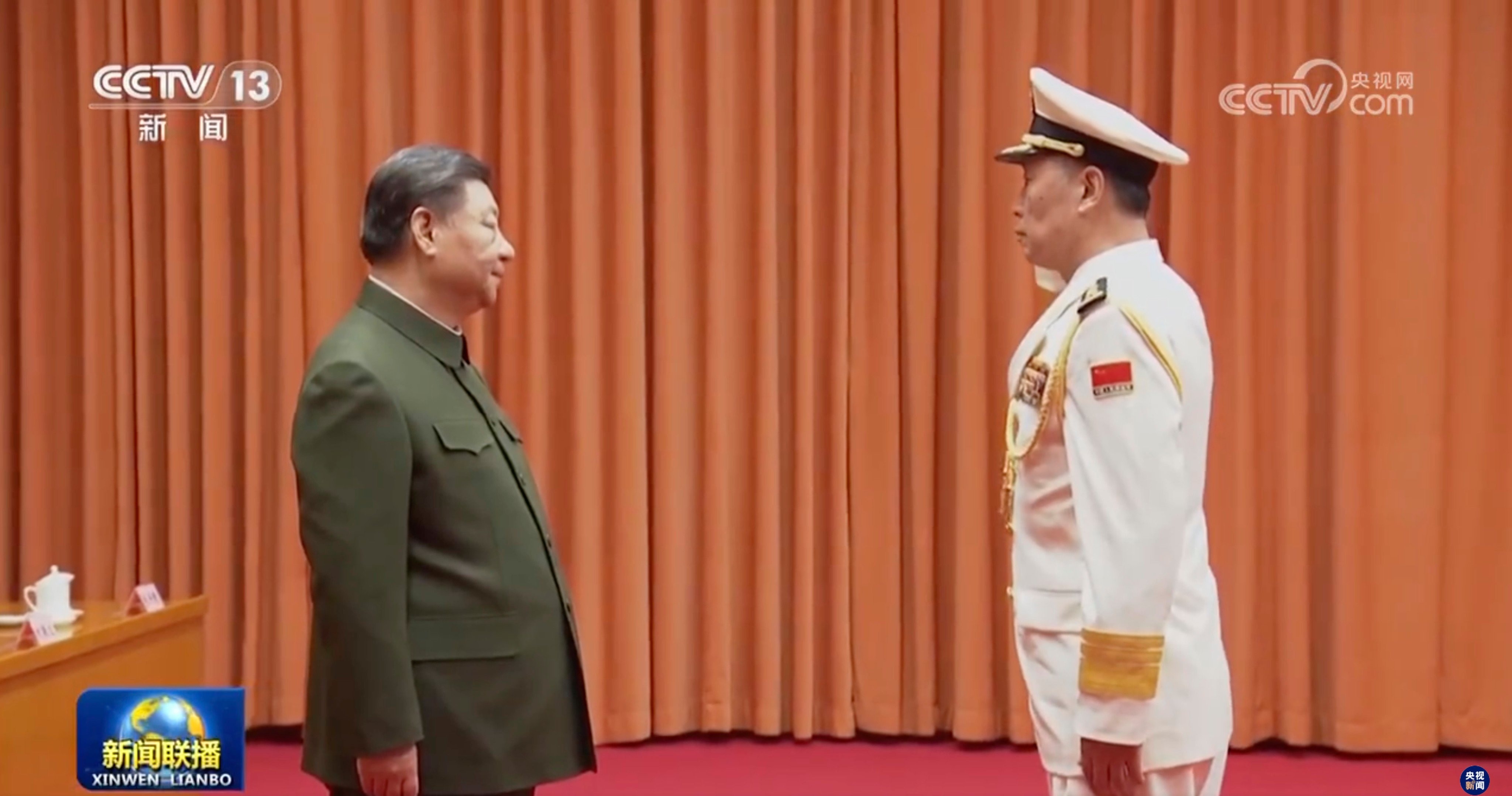 Chinese President Xi Jinping congratulates naval commander Hu Zhongming, commander of the navy, and Wang Wenquan, on his promotion to admiral. Photo: CCTV