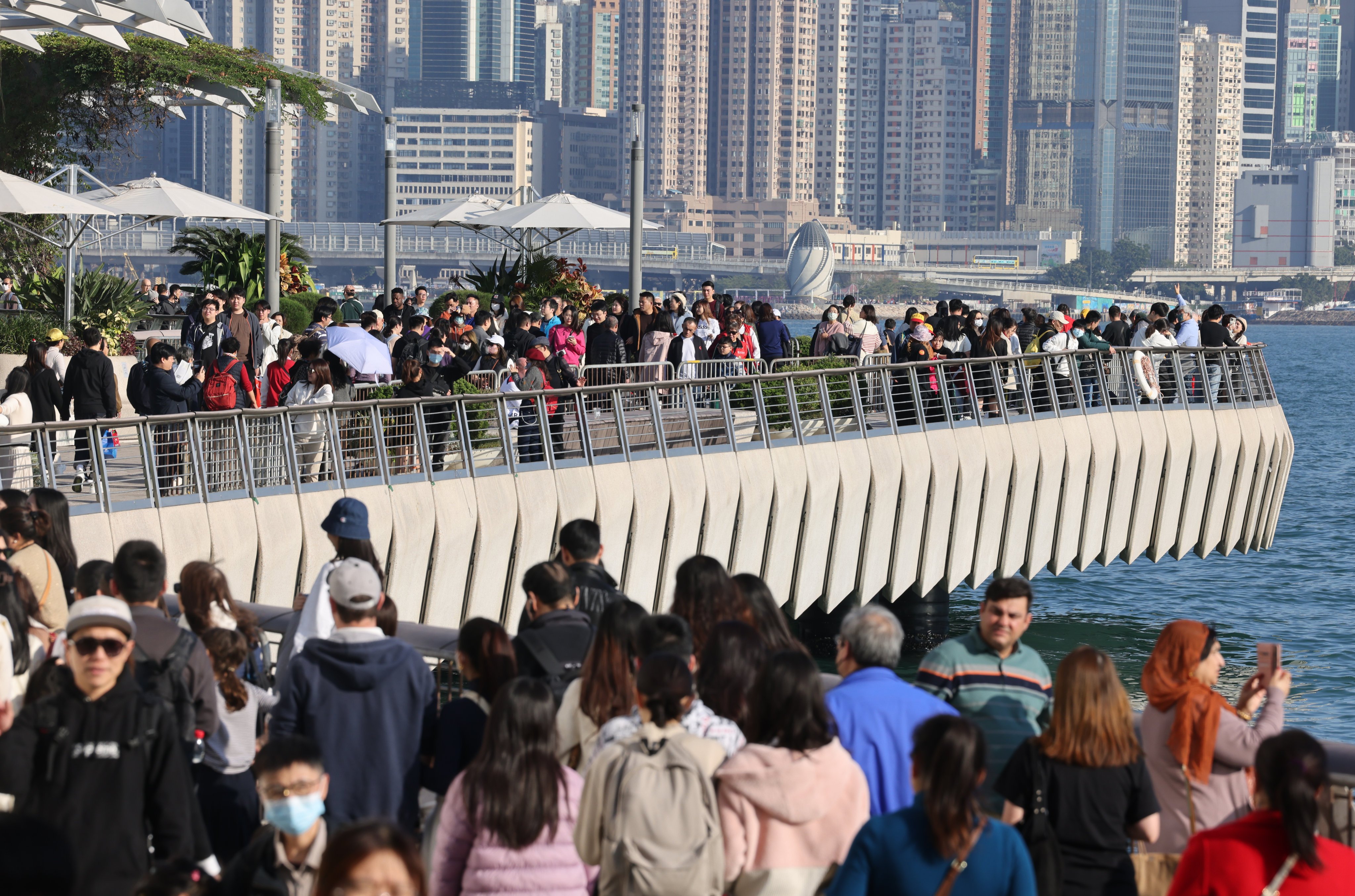 Tourists and residents at the Avenue of Stars at Victoria Harbour. More than 650,000 visitors from the mainland entered the city between Wednesday last week and Tuesday. Photo: Jelly Tse