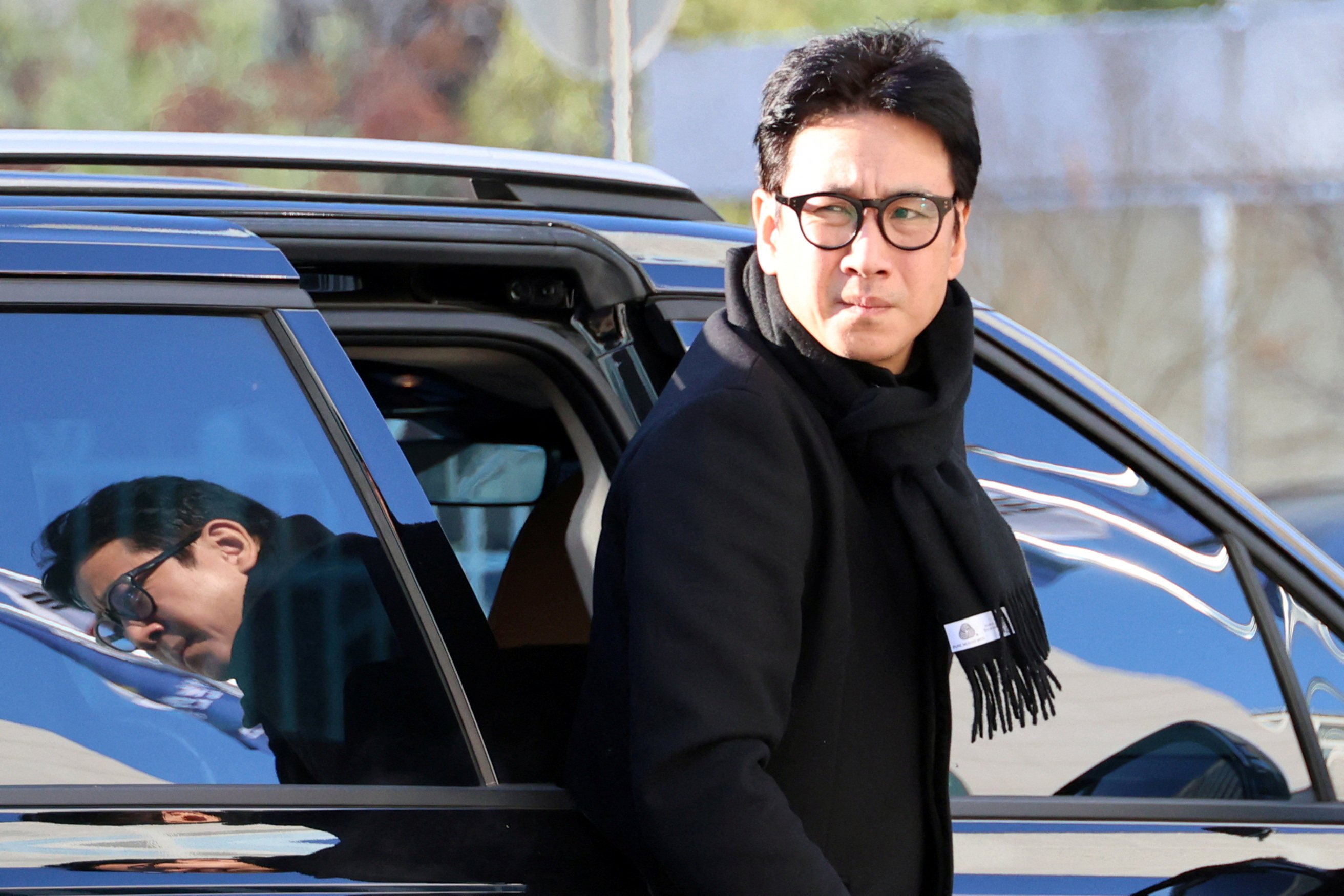 South Korean actor Lee Sun-kyun arrives at a police station in Incheon on December 23. Photo: Yonhap via Reuters