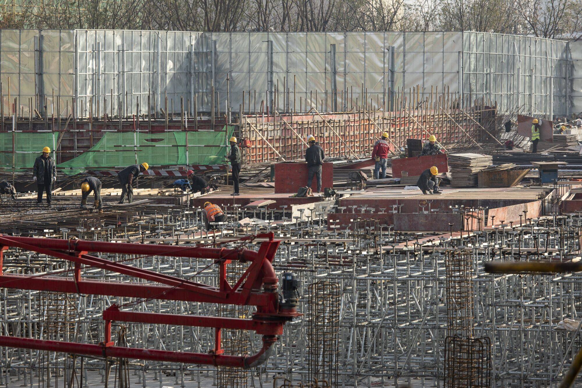 China’s weak property market has led state-owned developers to be late in paying their suppliers and contractors, compounding slackening trends in the economy. Photo: Bloomberg