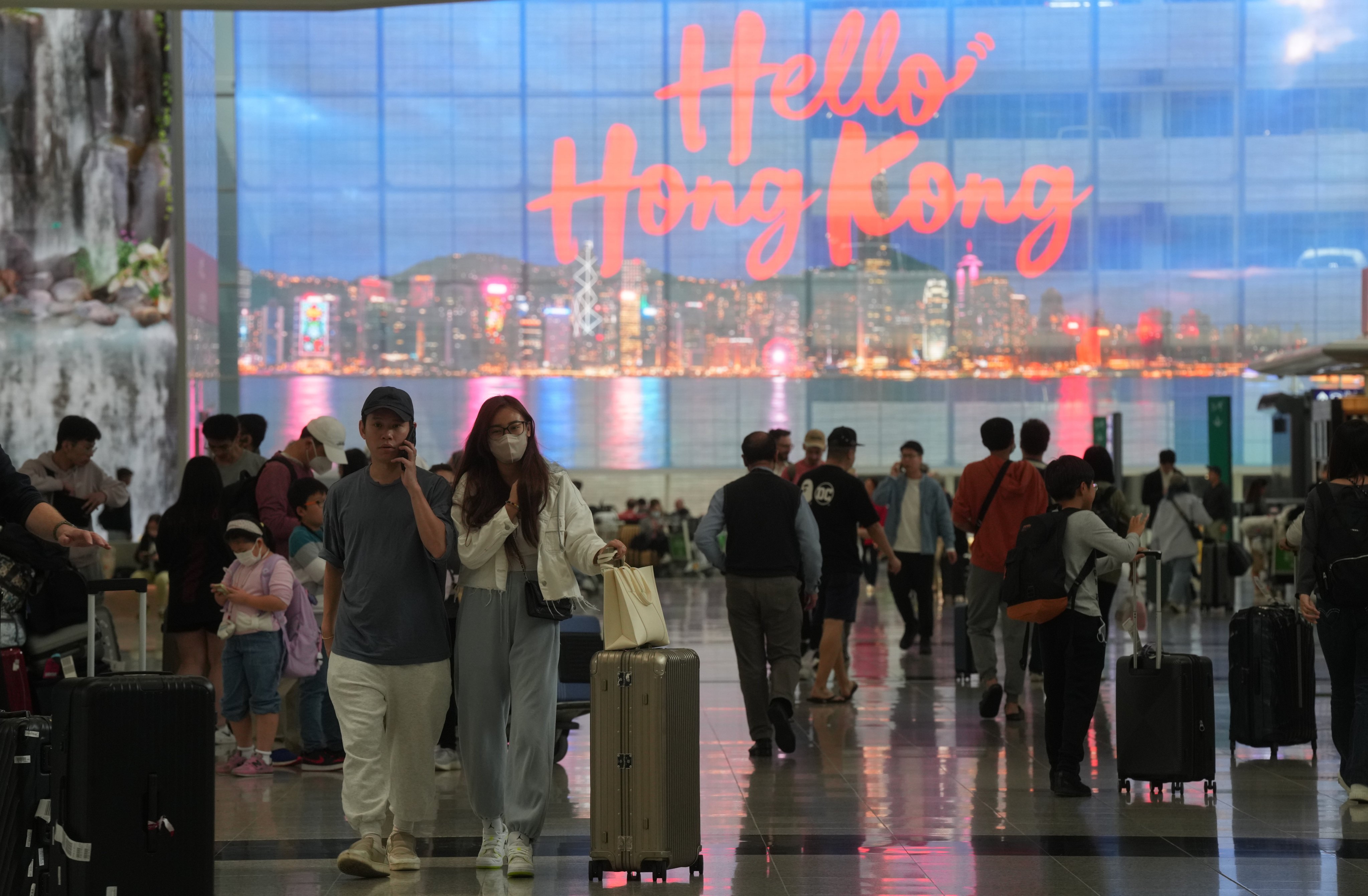 People arrive at Hong Kong international airport on April 10. It will take time to see how attractive the city’s new visa scheme is to high-net-worth individuals. Photo: Sam Tsang