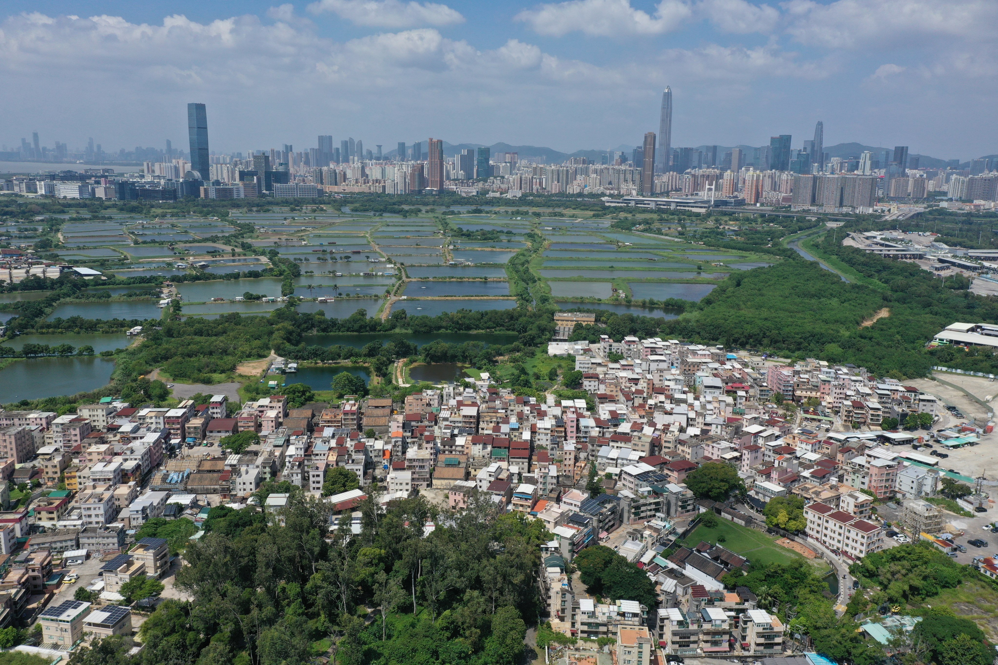 An aerial view of the San Tin area in the New Territories North, with wetlands and Shenzhen seen in the distance. Photo: Winson Wong