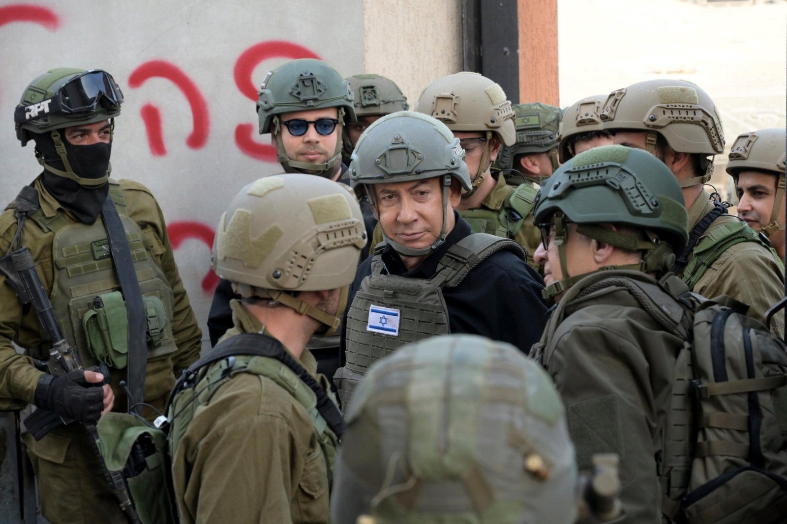 Israeli Prime Minister Benjamin Netanyahu receives a security briefing with commanders and soldiers in the northern Gaza Strip, on Monday. Photo: Avi Ohayon/GPO via Reuters