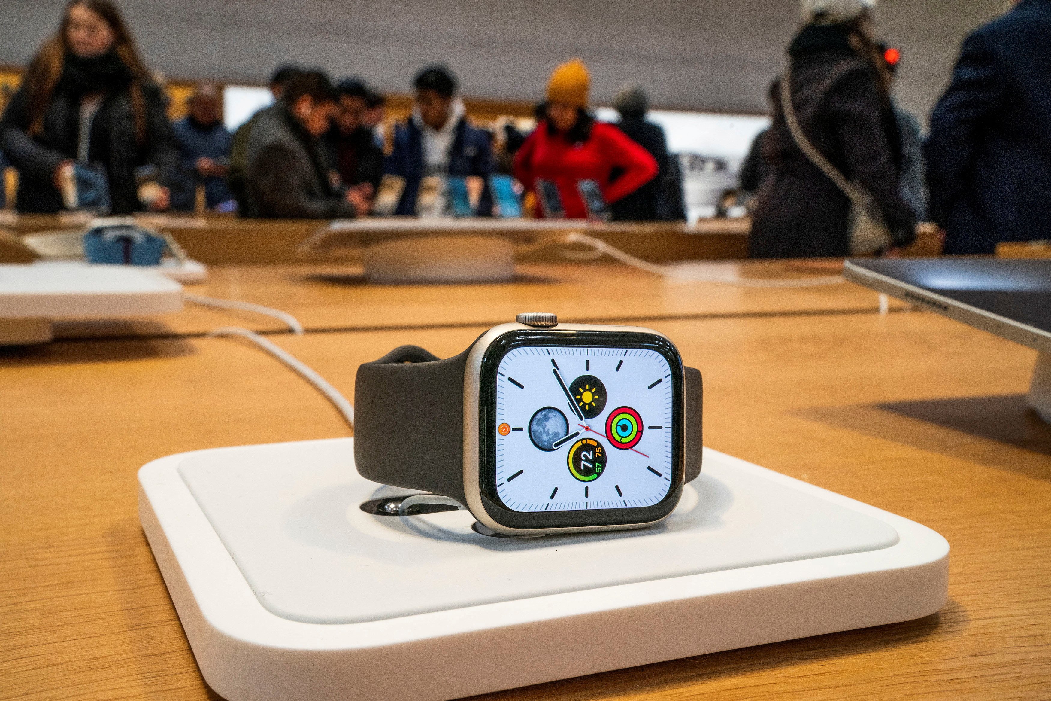 An Apple Watch is displayed as customers visit one of the company's stores in New York on December 26, 2023. Photo: Reuters