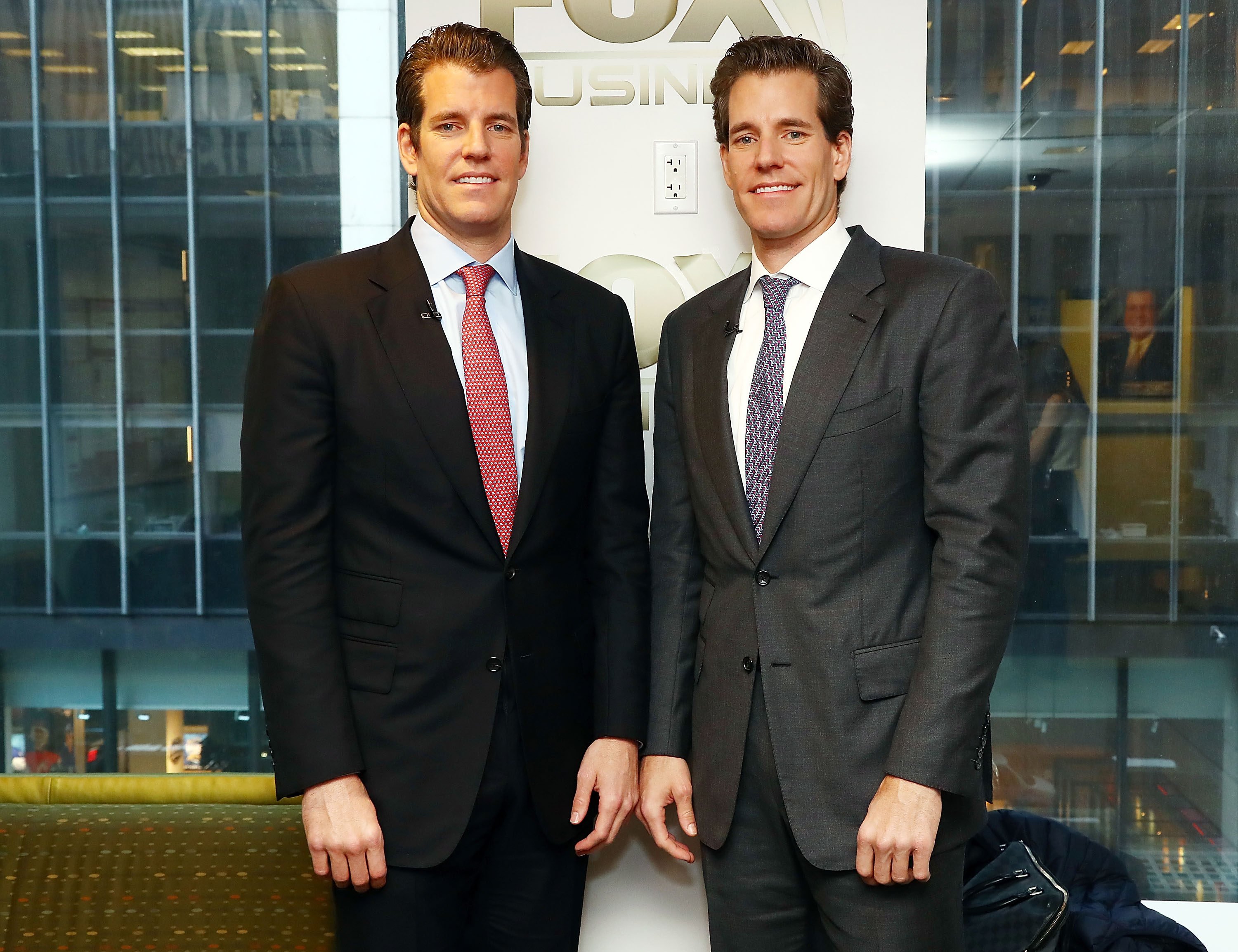 Twins Tyler Winklevoss (left) and Cameron Winklevoss have been on quite the journey together. Photo: Getty Images