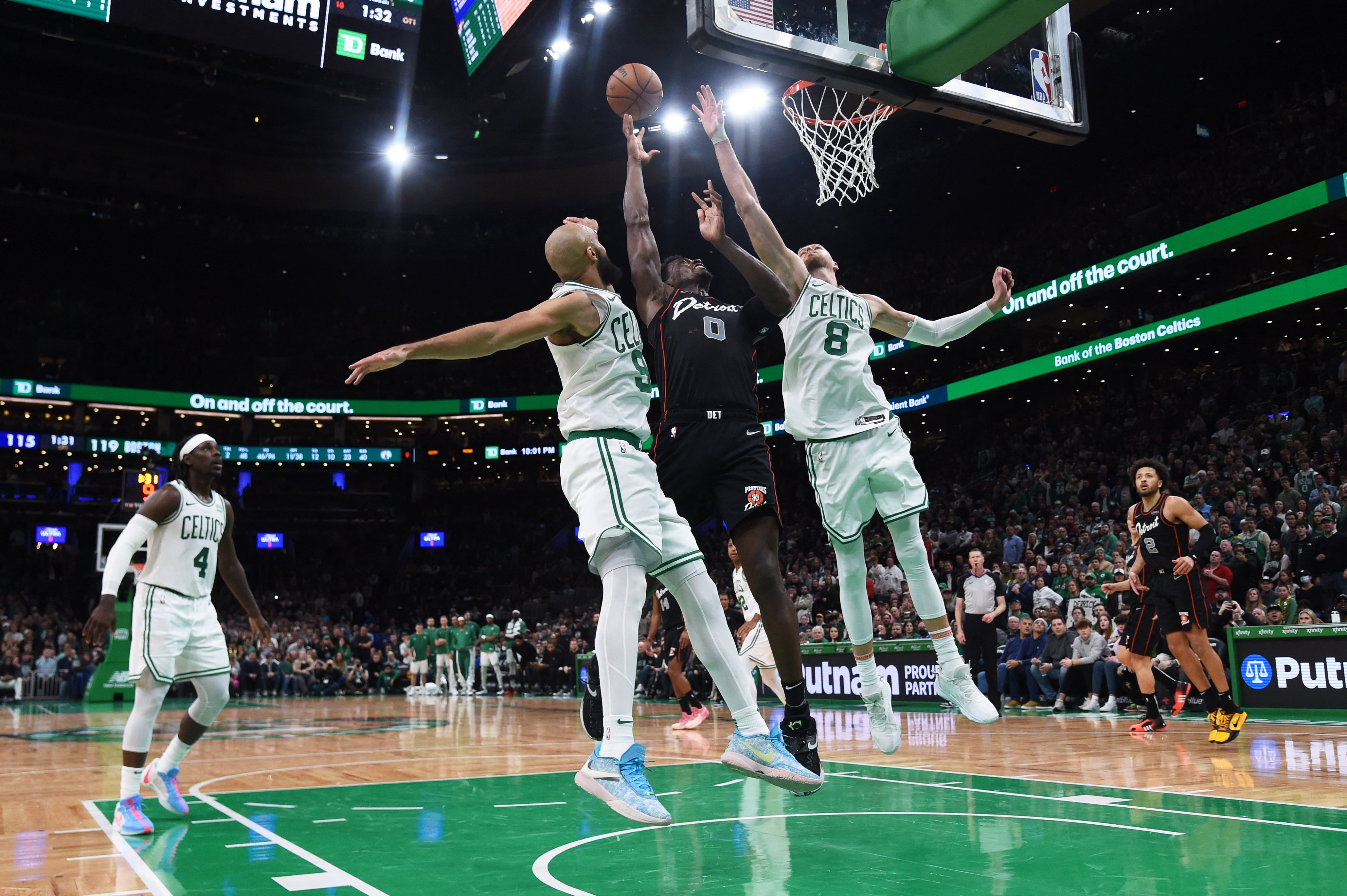 Boston Celtics guard Derrick White (left) Detroit Pistons centre Jalen Duren  and centre Kristaps Porzingis battle for a rebound during overtime at TD Garden. Photo: USA TODAY Sports