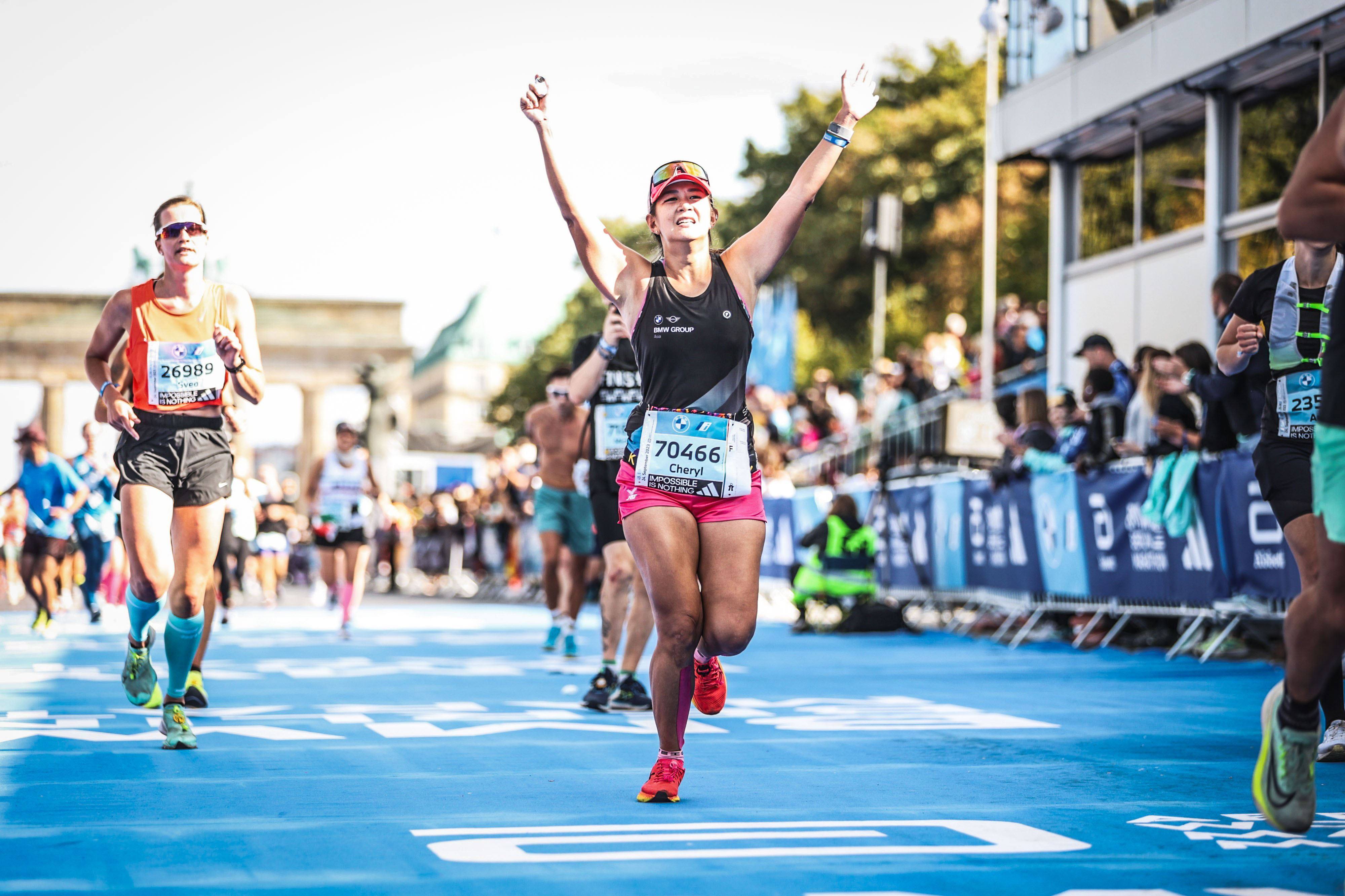 Singaporean fitness influencer Cheryl Tay struggled with body dysmorphia for more than 10 years, over-exercising, starving and binge eating. Today, happy and healthy, Tay (pictured above finishing the 2023 Berlin Marathon) shares her story. Photo: Cheryl Tay