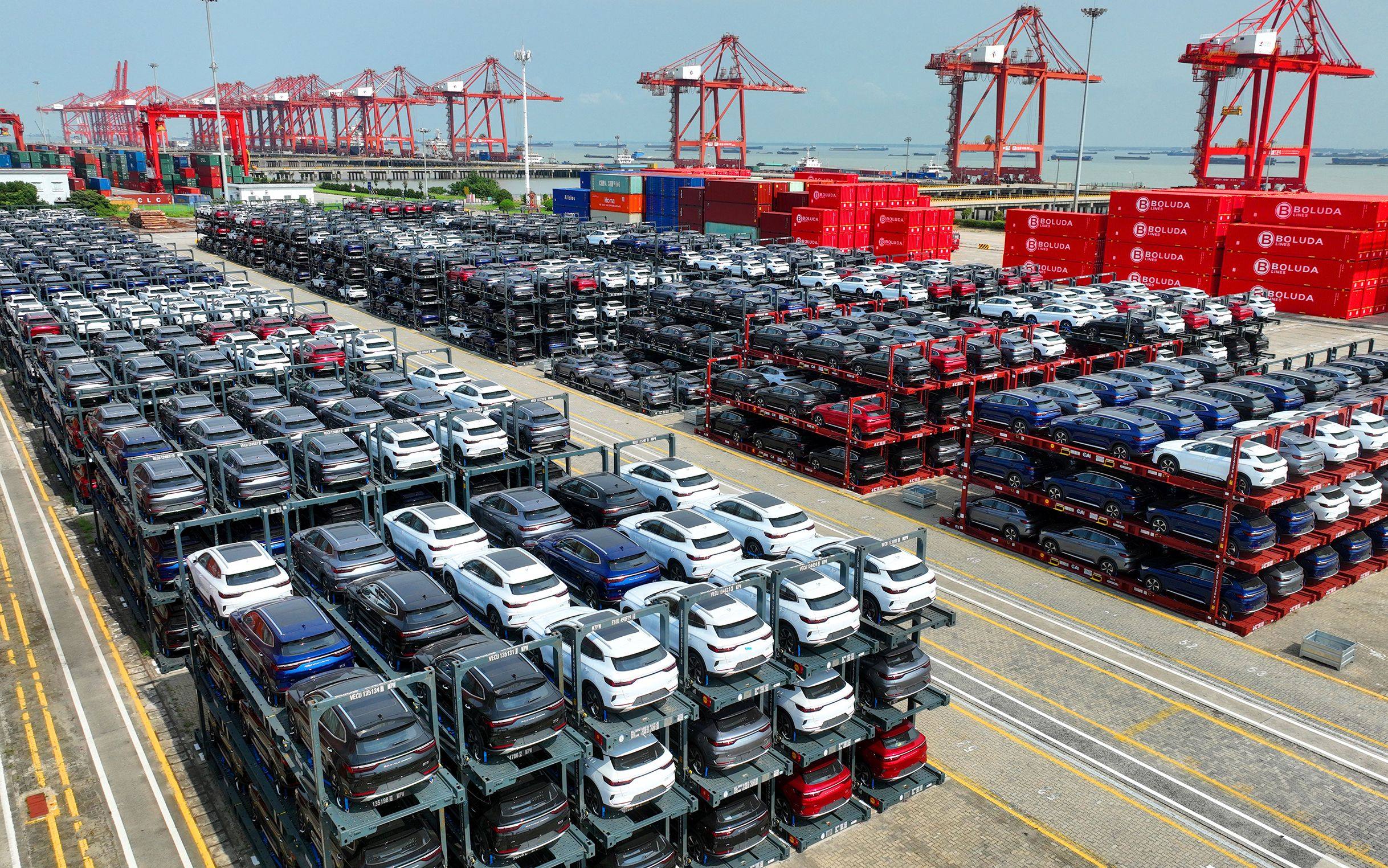 BYD electric cars are lined up waiting to be shipped from China’s Suzhou Port on September 11. Chinese brands now account for about half of EVs sold globally. Photo: AFP