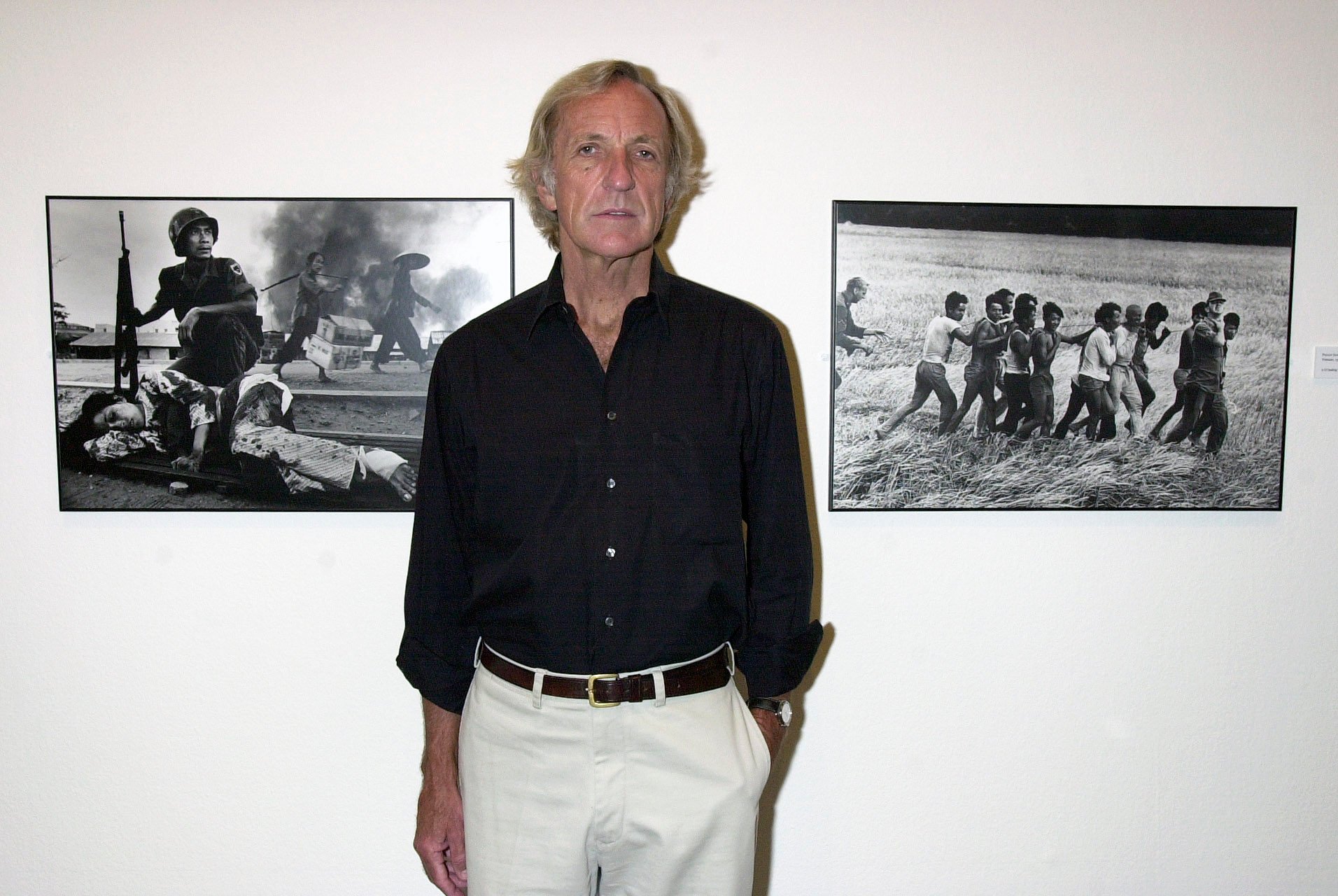 John Pilger attends an exhibition titled “John Pilger: Reporting The World” featuring work by various reportage photographers at London’s Barbican Art Gallery in 2001. Photo: Getty Images