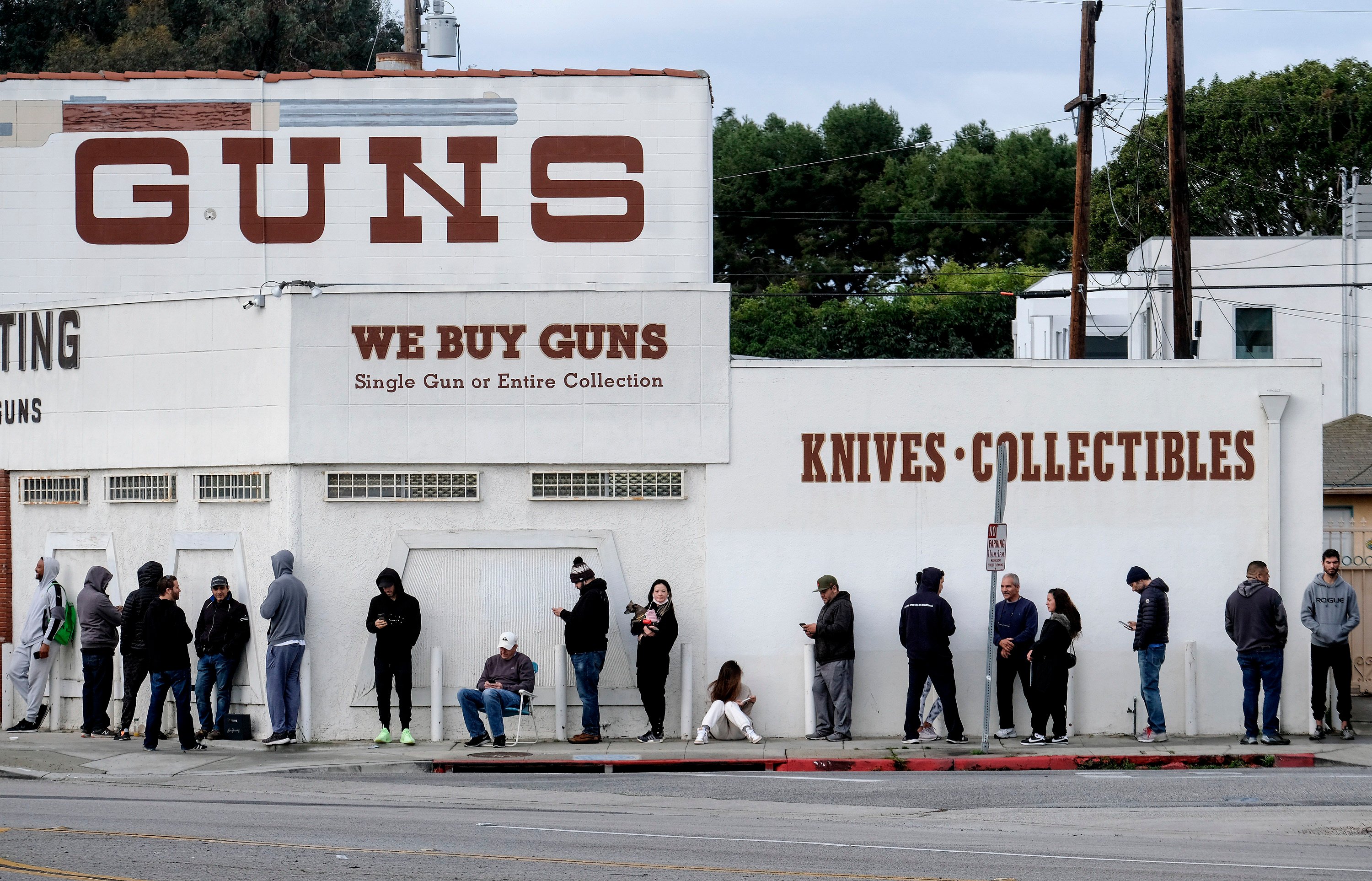 People wait to enter a gun shop in Culver City, California. On Saturday, a federal appeal court cleared the way for a California law that bans the carrying of guns in most public places to take effect at the start of 2024.  Photo: AP