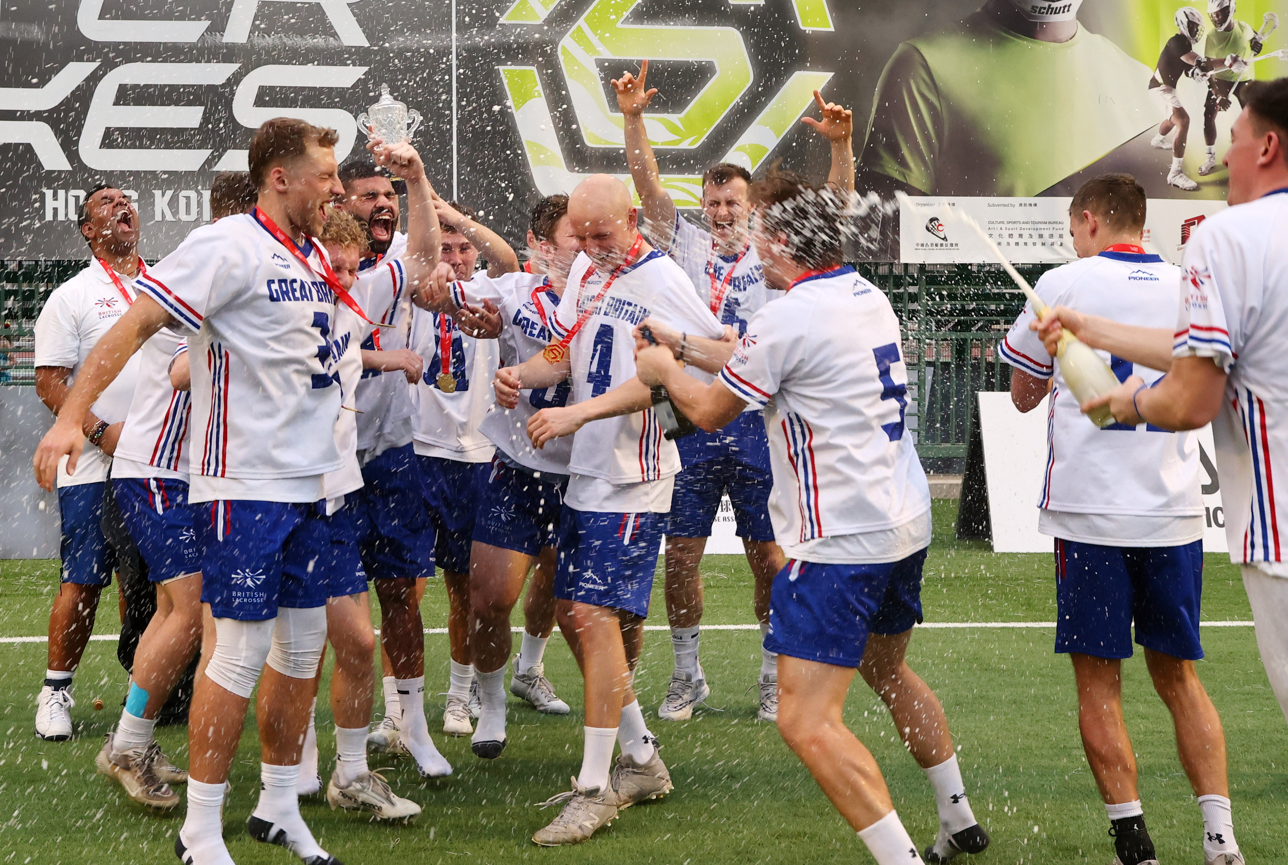 Great Britain’s men celebrate winning their tournament at the World Lacrosse Super Sixes in Hong Kong. Photo: Dickson Lee