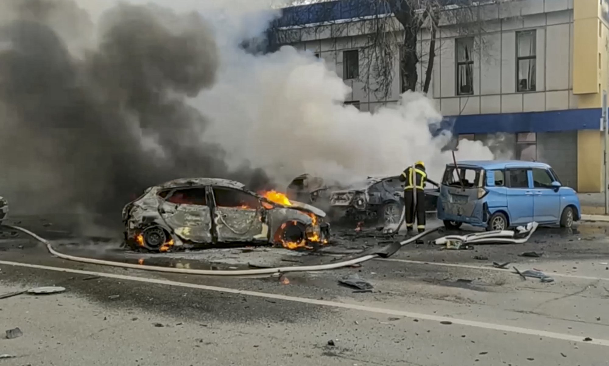 Russian firefighters extinguish burning cars after shelling in Belgorod, Russia on December, 30 2023. Photo: EPA-EFE/Russian Emergencies Ministry Handout