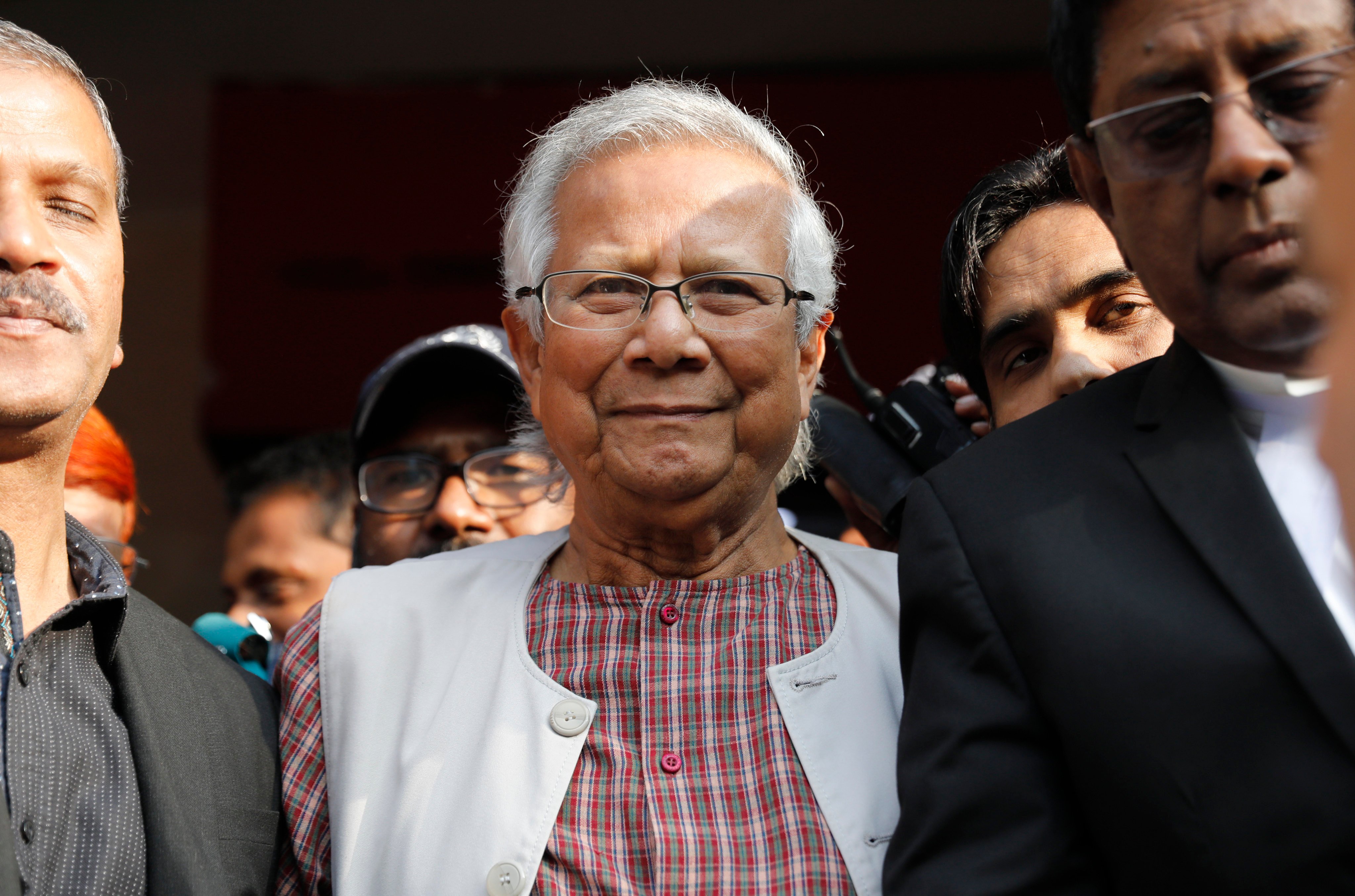 Nobel Peace Prize winner Muhammad Yunus comes out after a labor court sentenced him to 6 months in jail for labor law violations in Dhaka, Bangladesh on Monday. Photo: AP
