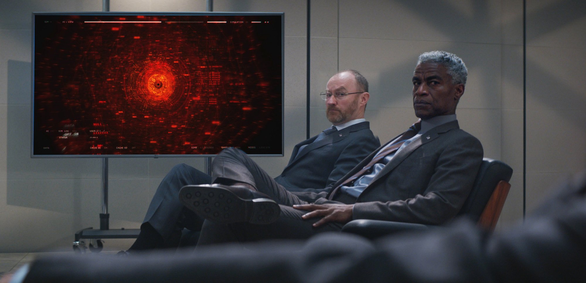 Mark Gatiss (left) and Charles Parnell in front of ‘The Entity’, one of the film’s main antagonists, in a still from “Mission: Impossible – Dead Reckoning Part 1”. Photo: Paramount Pictures and Skydance
