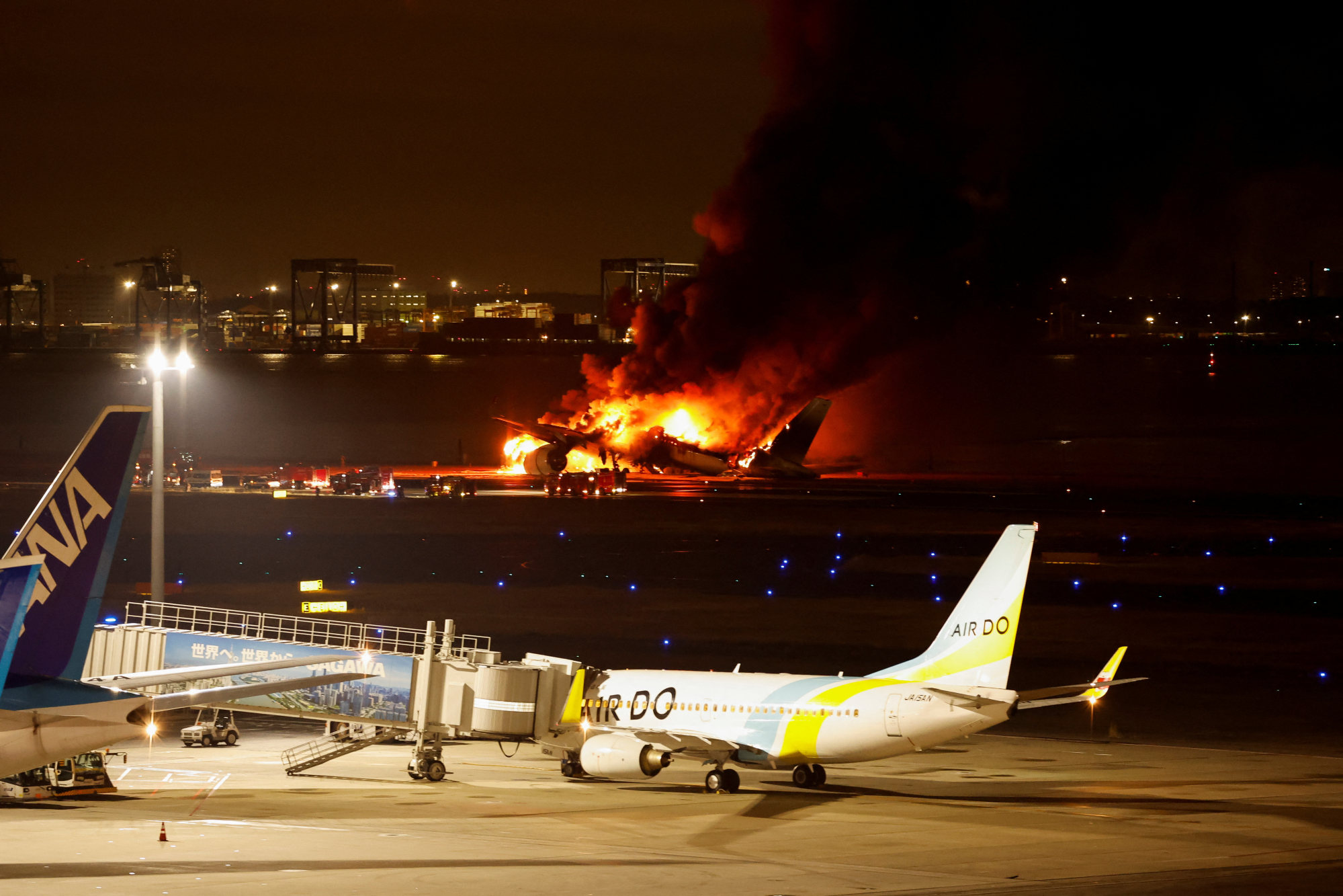 Japan Airlines’ A350 aeroplane is on fire at Haneda international airport in Tokyo, Japan on Tuesday. Photo: Reuters