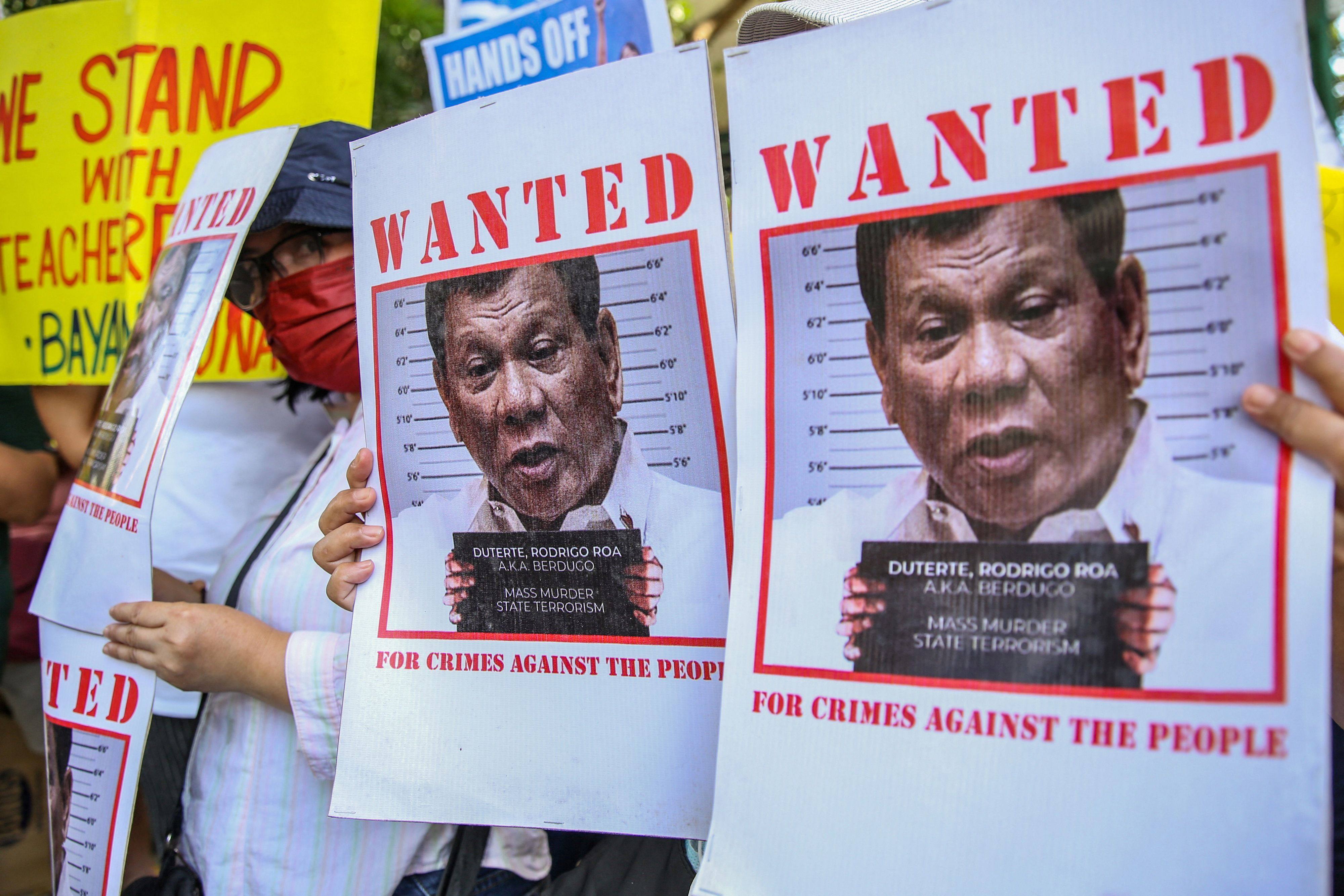 Supporters of Philippine lawmaker France Castro hold a noise barrage before the preliminary investigation of her grave threat complaint filed against former president Rodrigo Duterte outside the Prosecutors Office in Quezon City. The ICC last July sought to reopen the investigation into alleged crimes against humanity committed under Duterte’s drug war. Photo: AFP