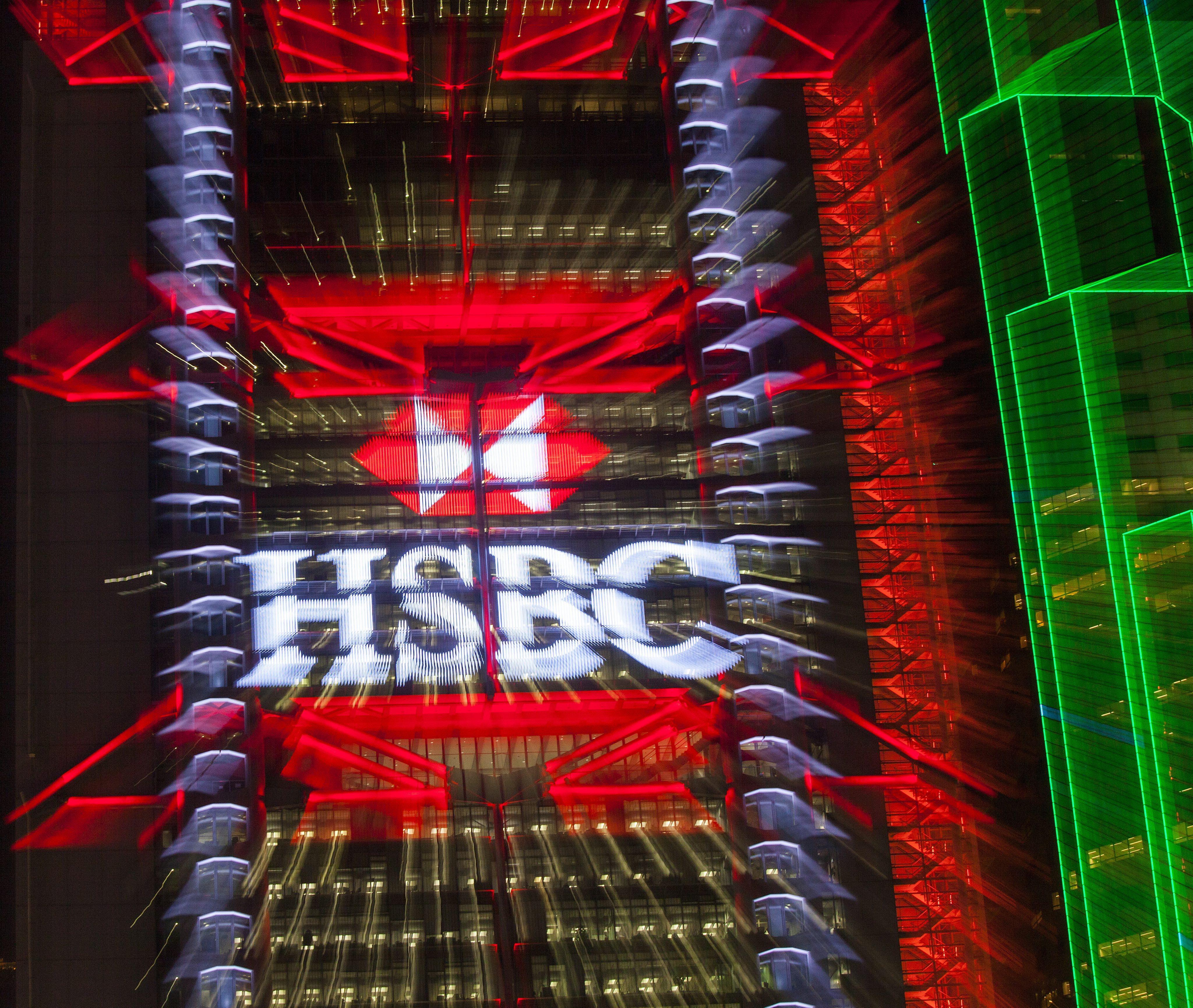 HSBC logo is seen lit up on the exterior of the HSBC headquarters building in Hong Kong’s financial district, Hong Kong, China. Photo: EPA