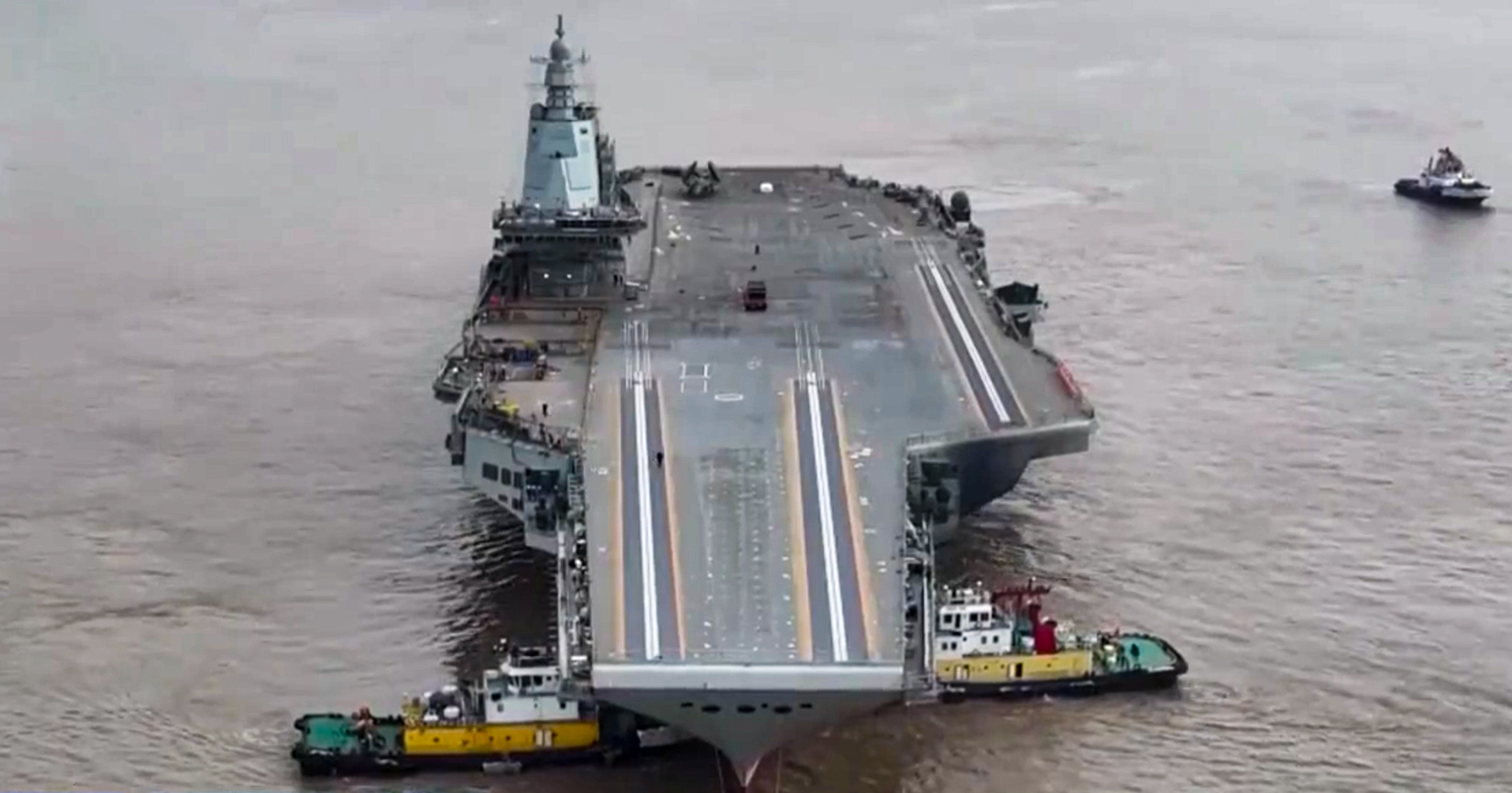 CCTV shows footage of the aircraft carrier Fujian being manoeuvred by tugboats. Photo: CCTV