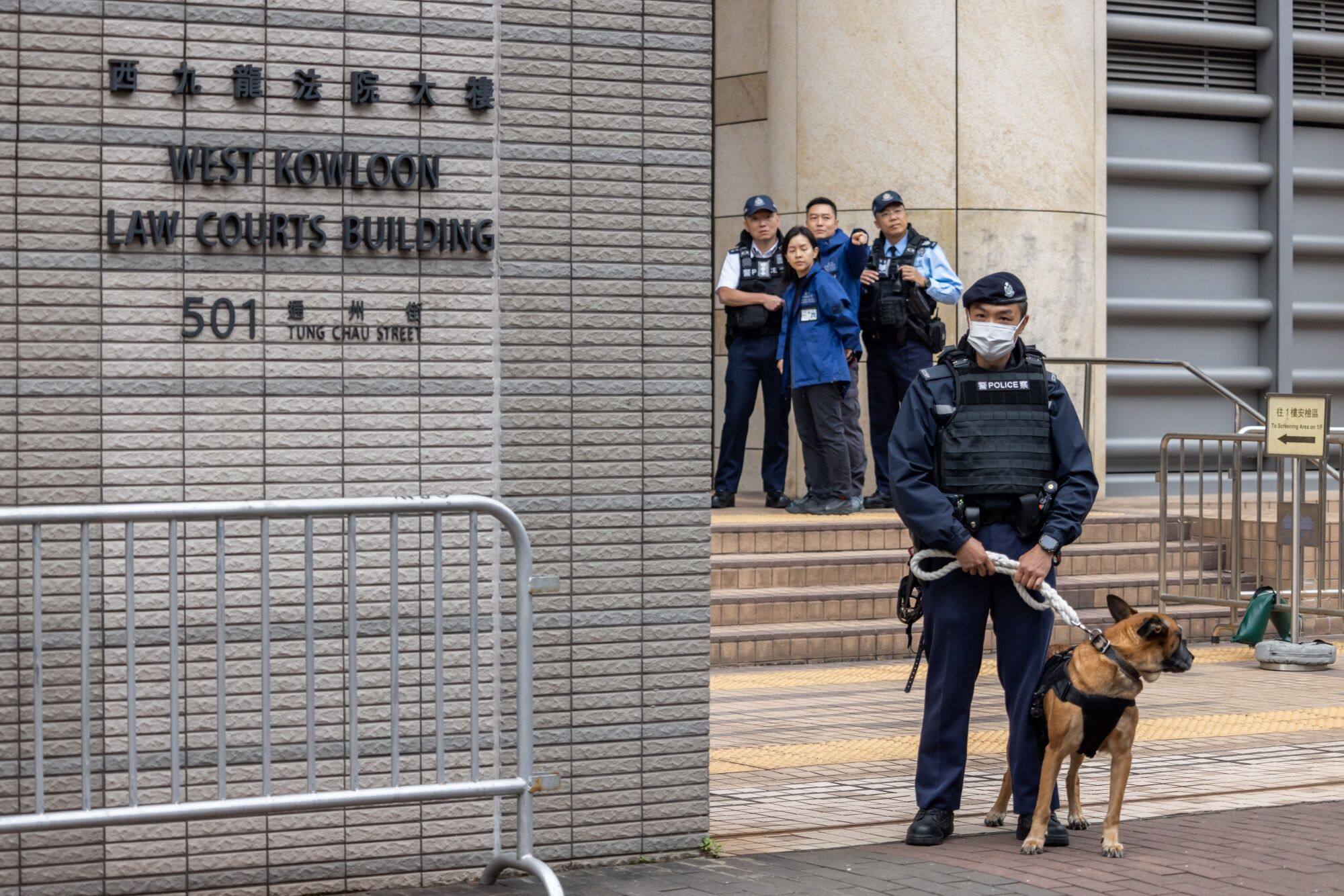 A police officersguards the West Kowloon Magistrates’ Courts ahead of a hearing for former media mogul Jimmy Lai on Monday. Photo: Bloomberg