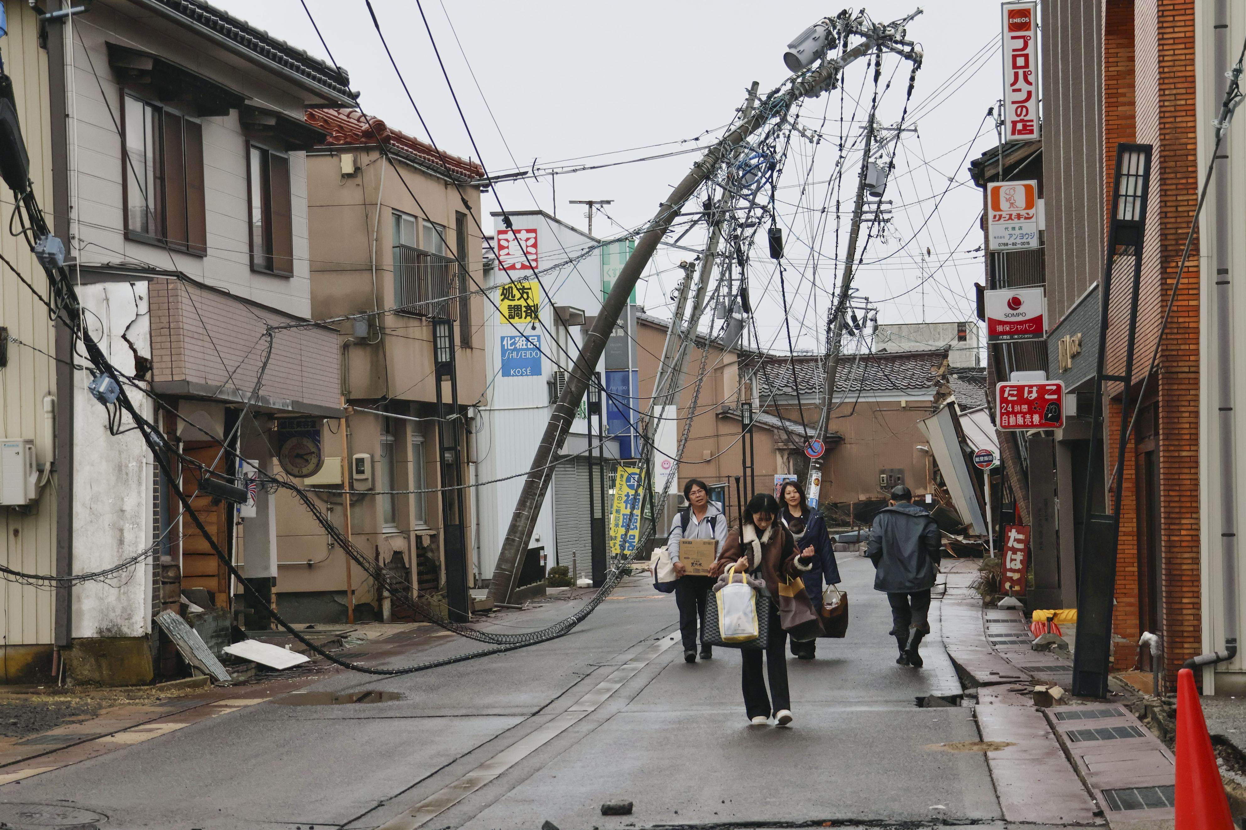 People walk in Suzu in Ishikawa Prefecture that was affected by a strong earthquake on January 1. Photo: Kyodo