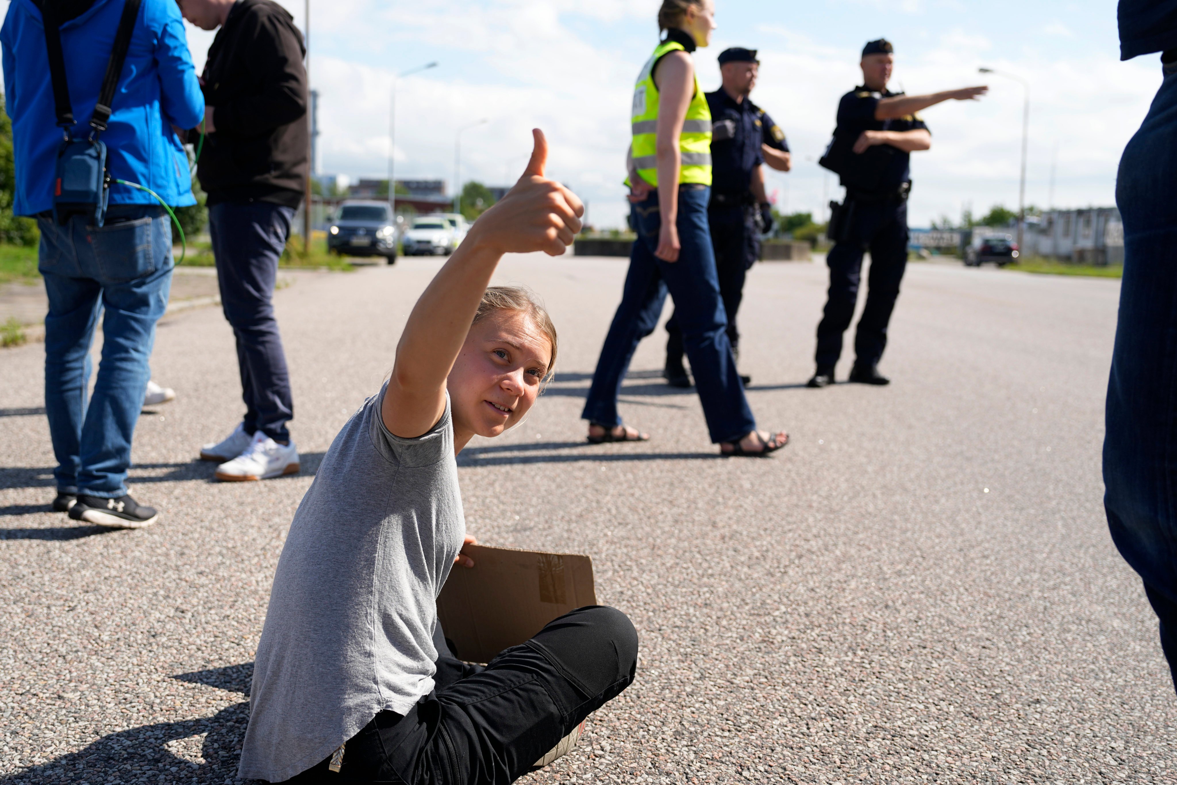 Climate activist Greta Thunberg gestures while blocking the entrance to an oil facility in Malmo, Sweden, on July 24 last year. Photo: AP