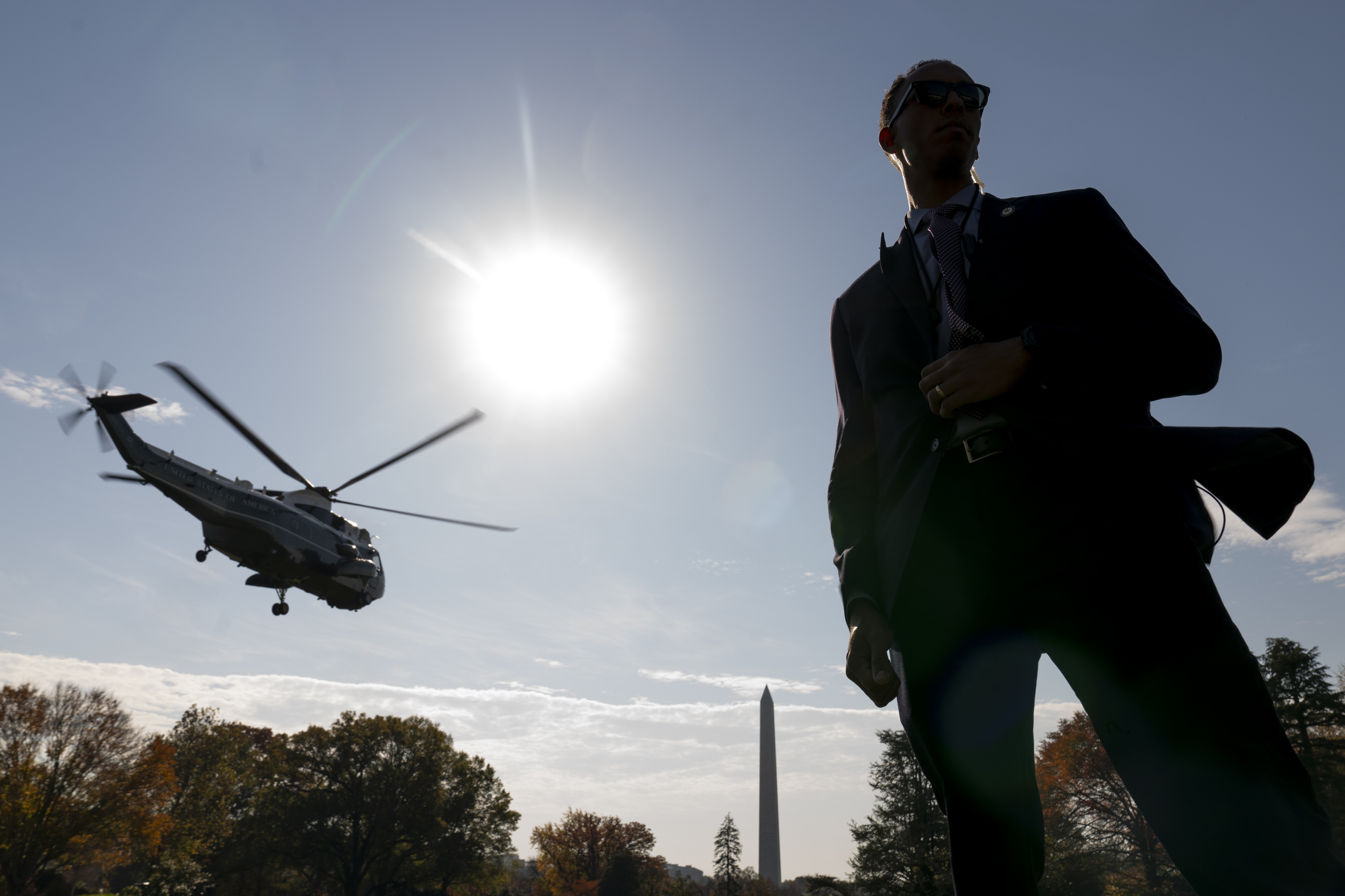 The Washington Monument in the background as a member of the Secret Service stands guard in the South Lawn of the White House in Washington, US. Photo: AP