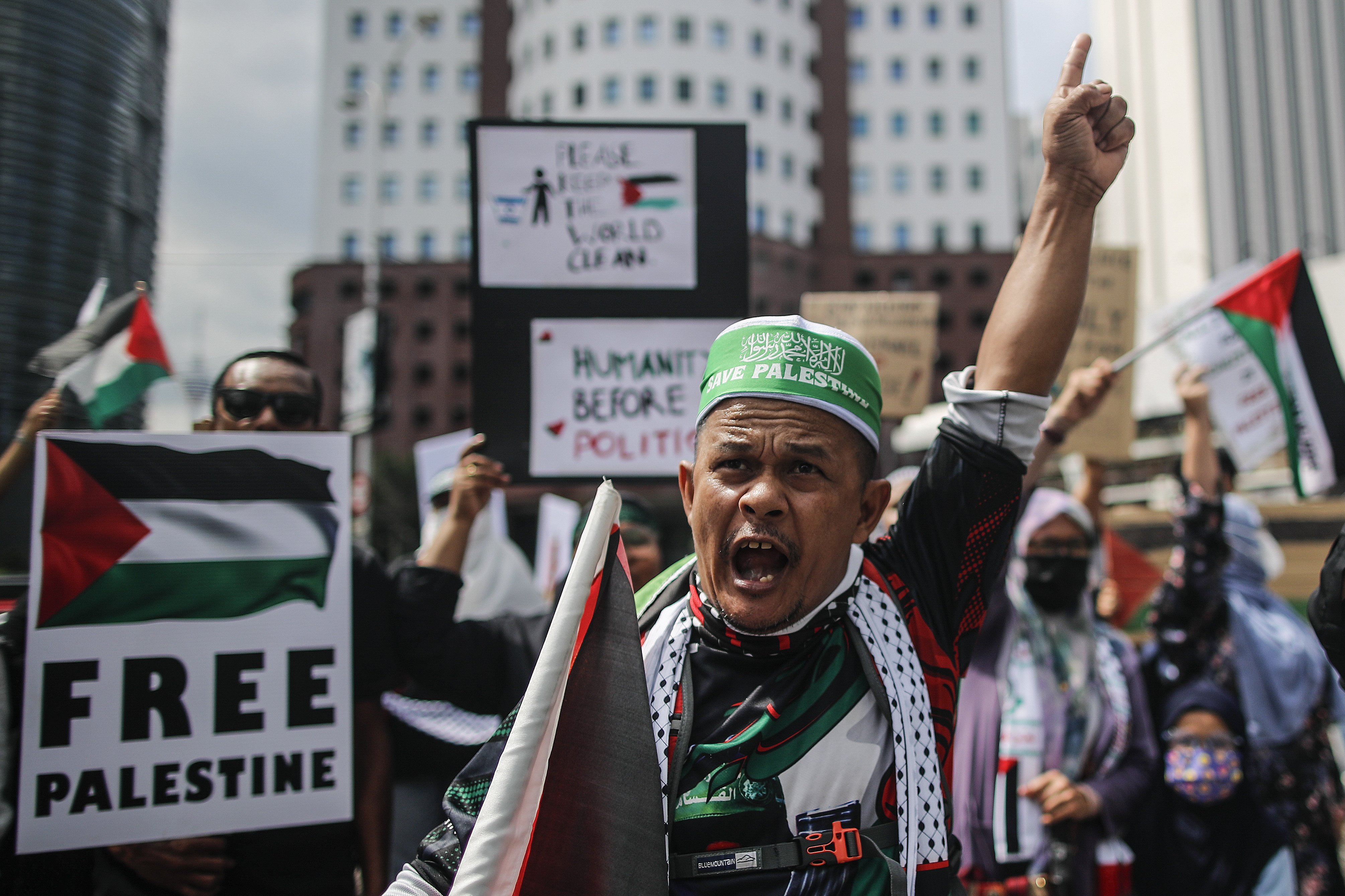 People at a ‘Free Palestine’ rally near the US embassy in Kuala Lumpur. Photo: EPA-EFE 