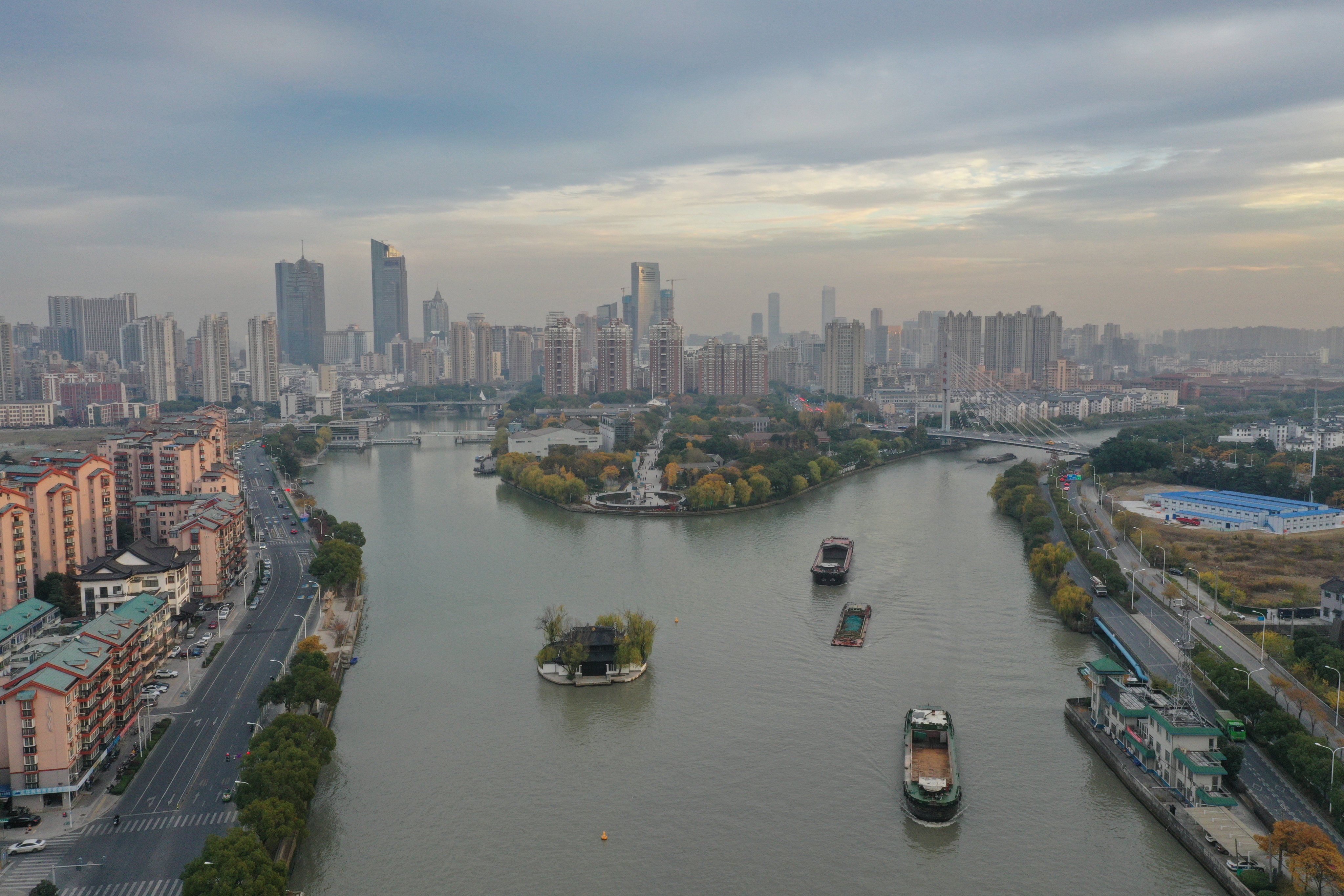 Barges traverse the Grand Canal in Wuxi, Jiangsu province, on December 9, 2023. Wuxi’s approach to drawing and promoting hi-tech industries in its evolution from an industrial hub to one of innovation can be an example for other municipal governments in China. Photo: Xinhua