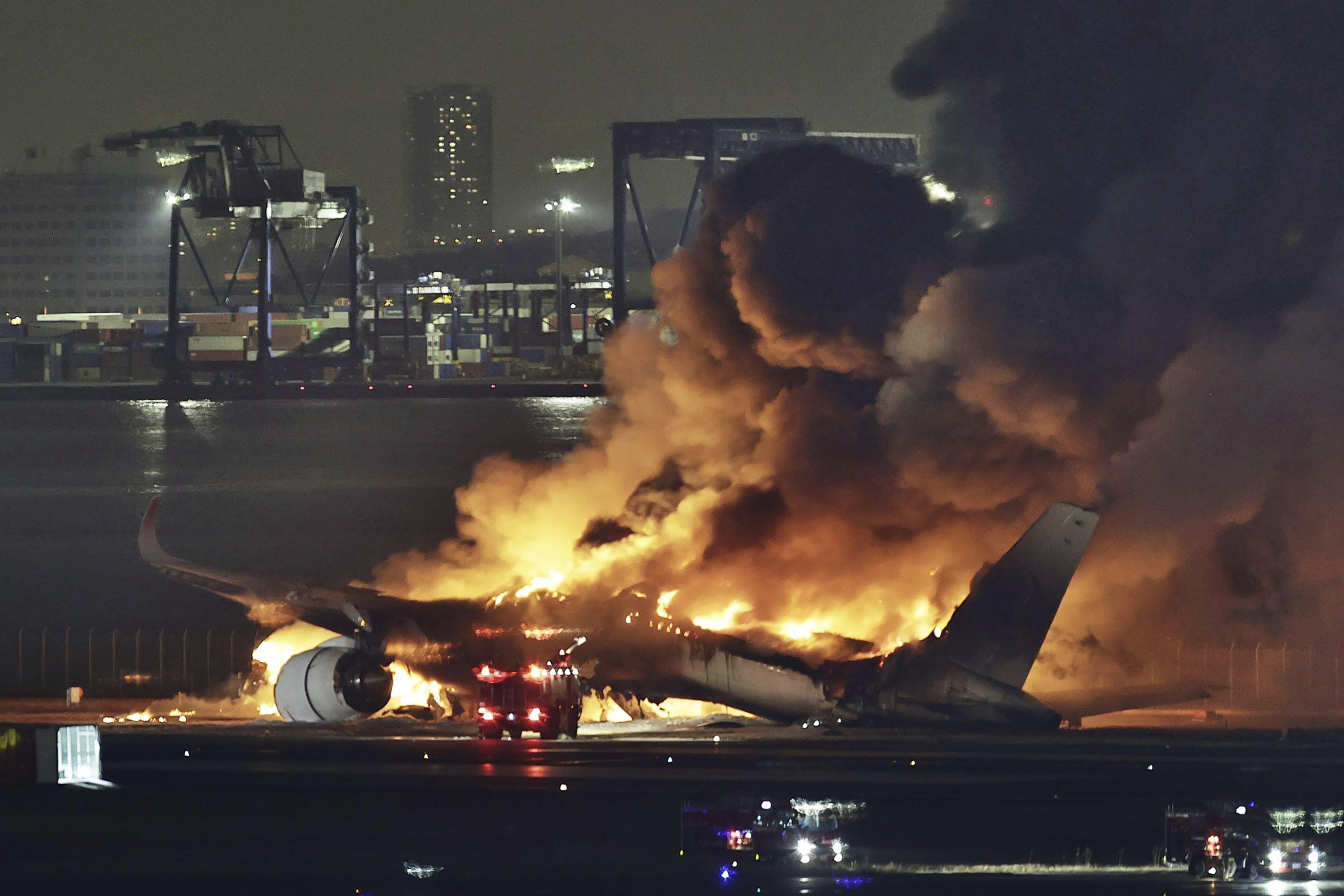 A Japan Airlines plane on fire at Tokyo’s Haneda airport on January 2. Photo: Kyodo News via AP