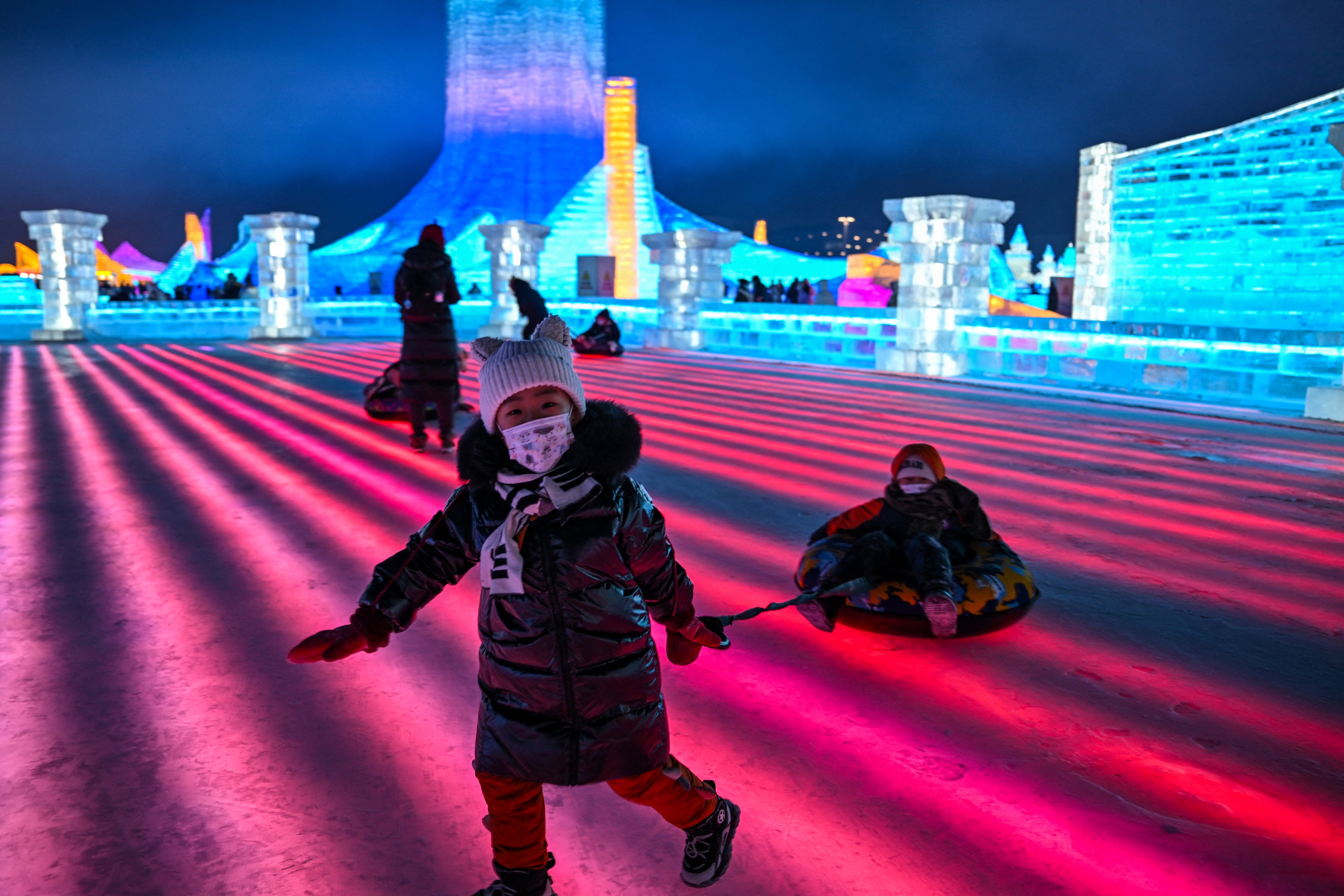 Children play at the Harbin Ice and Snow World in Harbin during the opening ceremony of the 39th Harbin China International Ice and Snow Festival on January 5, 2023. To reignite its tourist appeal, Hong Kong could take lessons from the mainland Chinese city. Photo: AFP