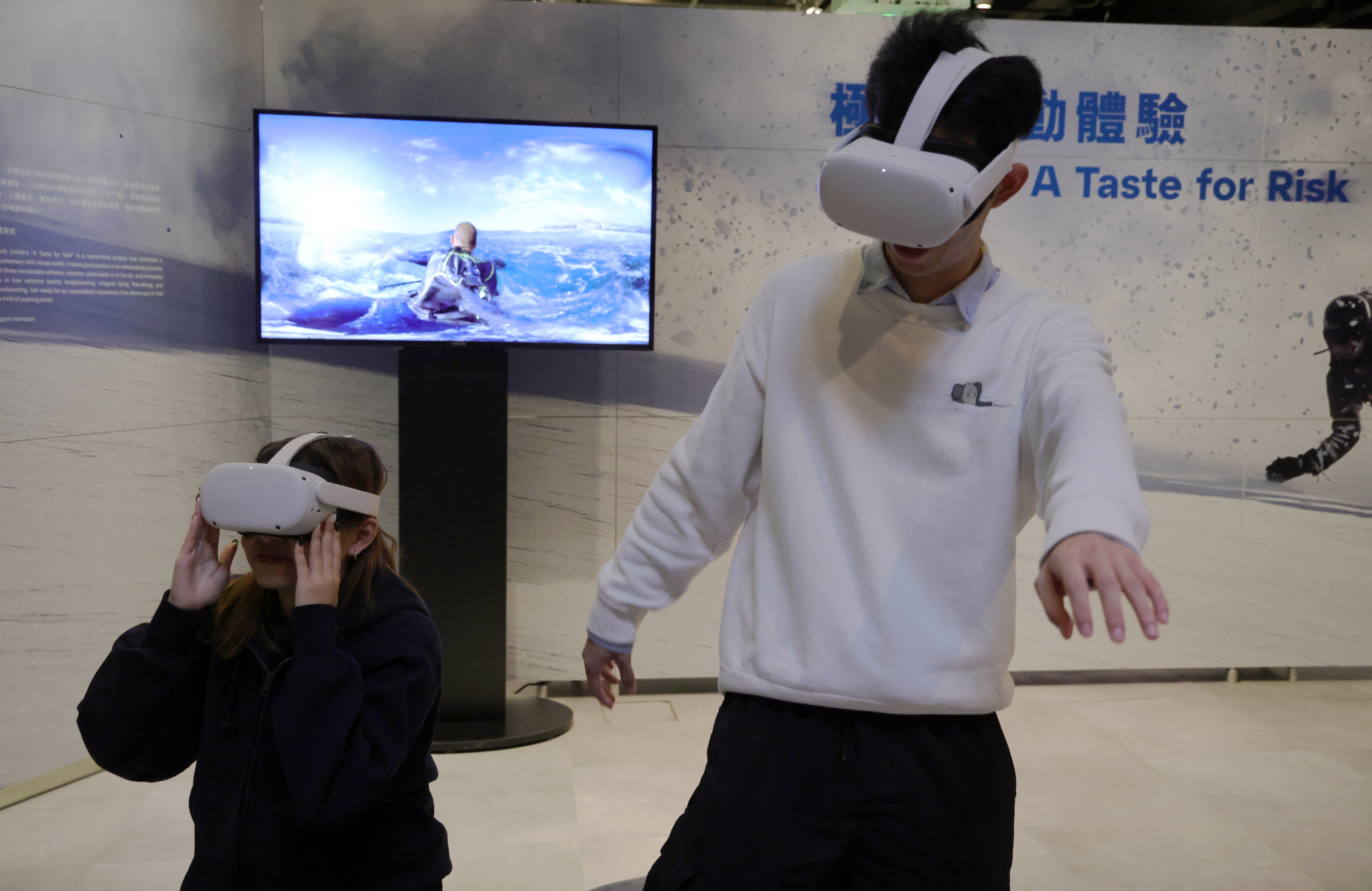 Staff at the Hong Kong Science Museum seen immersing themselves in a virtual reality experience on November 9. 2023. Photo: May Tse