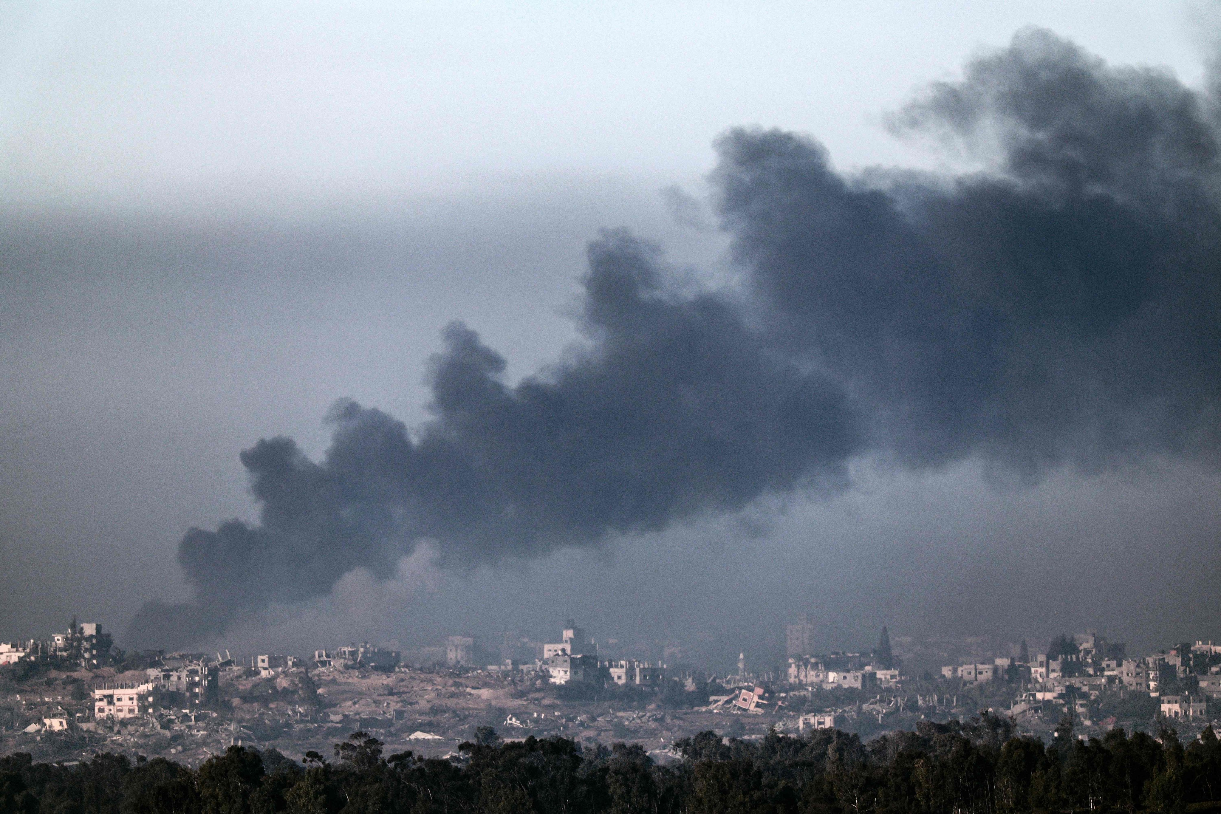 A photo taken from a position in southern Israel along the border with the Gaza Strip, shows Smoke billowing over the Palestinian territory during Israeli bombardment on Thursday amid continuing battles between Israel and Hamas. Photo: AFP