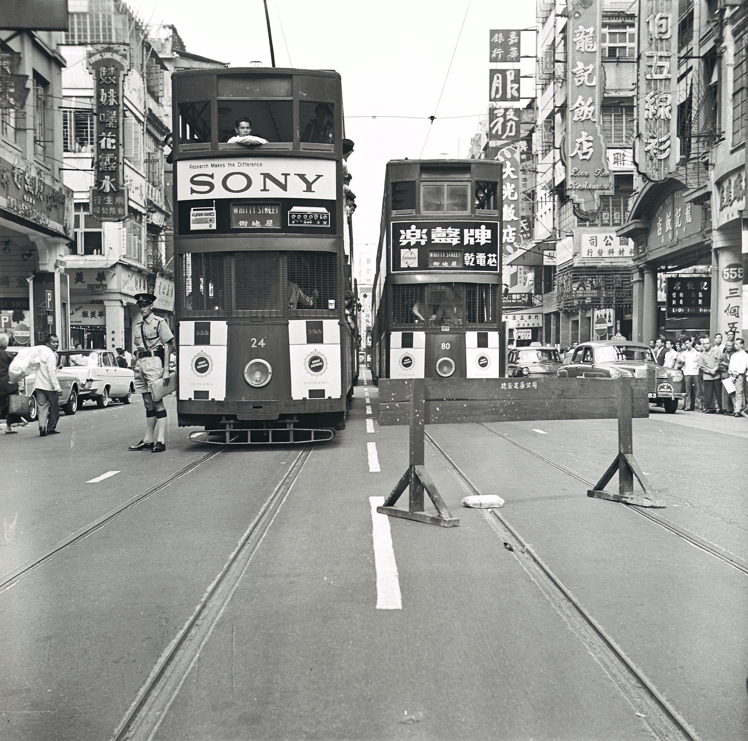 Trams on Hong Kong’s Des Voeux Road Central in the 1960s. The road was the scene of an exchange of fire between police and armed robbers in January 1963. Photo: SCMP