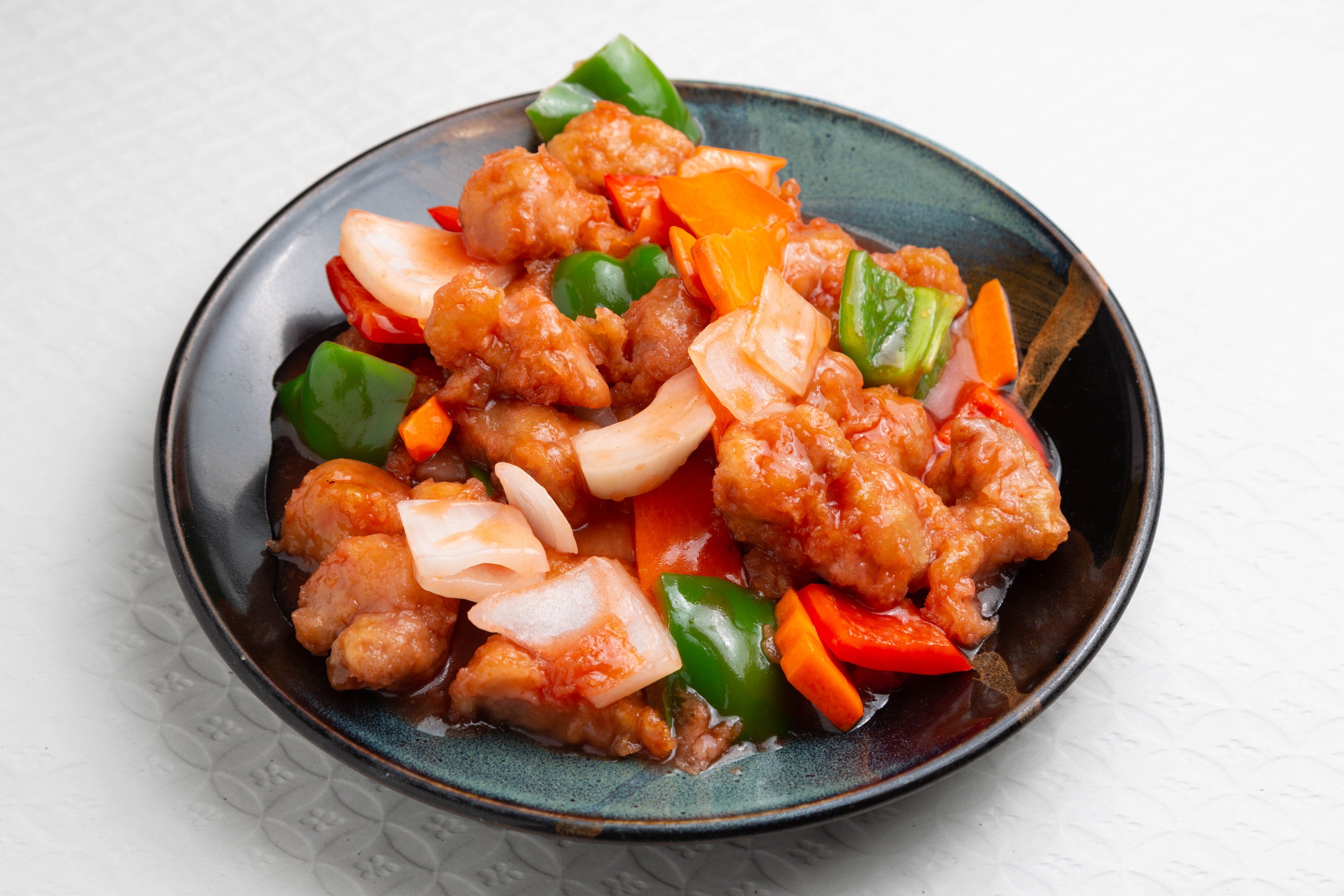 Sweet and sour pork is a Chinese food staple adored globally. Hong Kong chefs chart its evolution via Chinese takeaway restaurants in the UK, and describe the versions they serve today. Photo: Getty Images