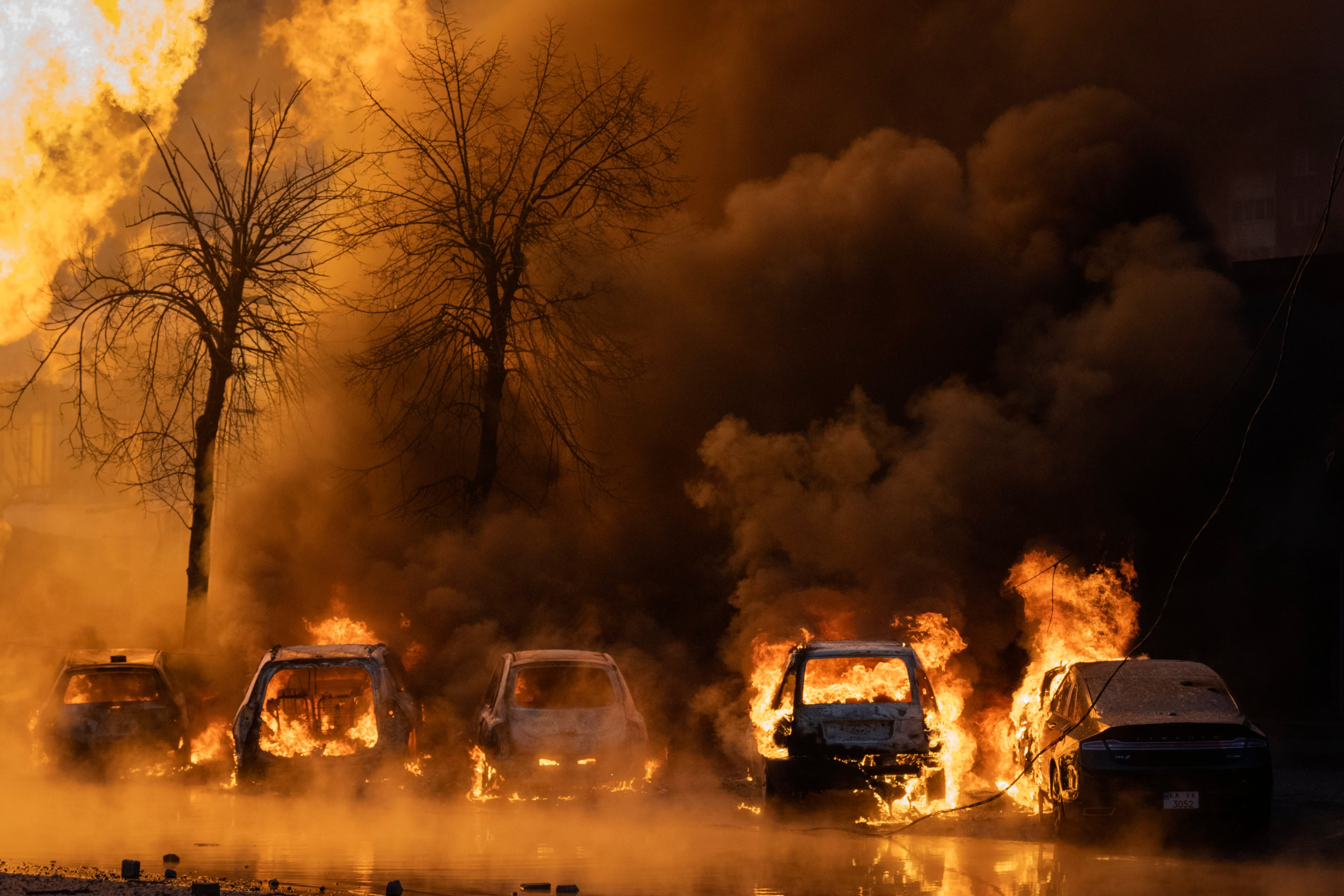 Cars burn after a Russian missile attack in Kyiv, Ukraine, on Tuesday. Photo: AP