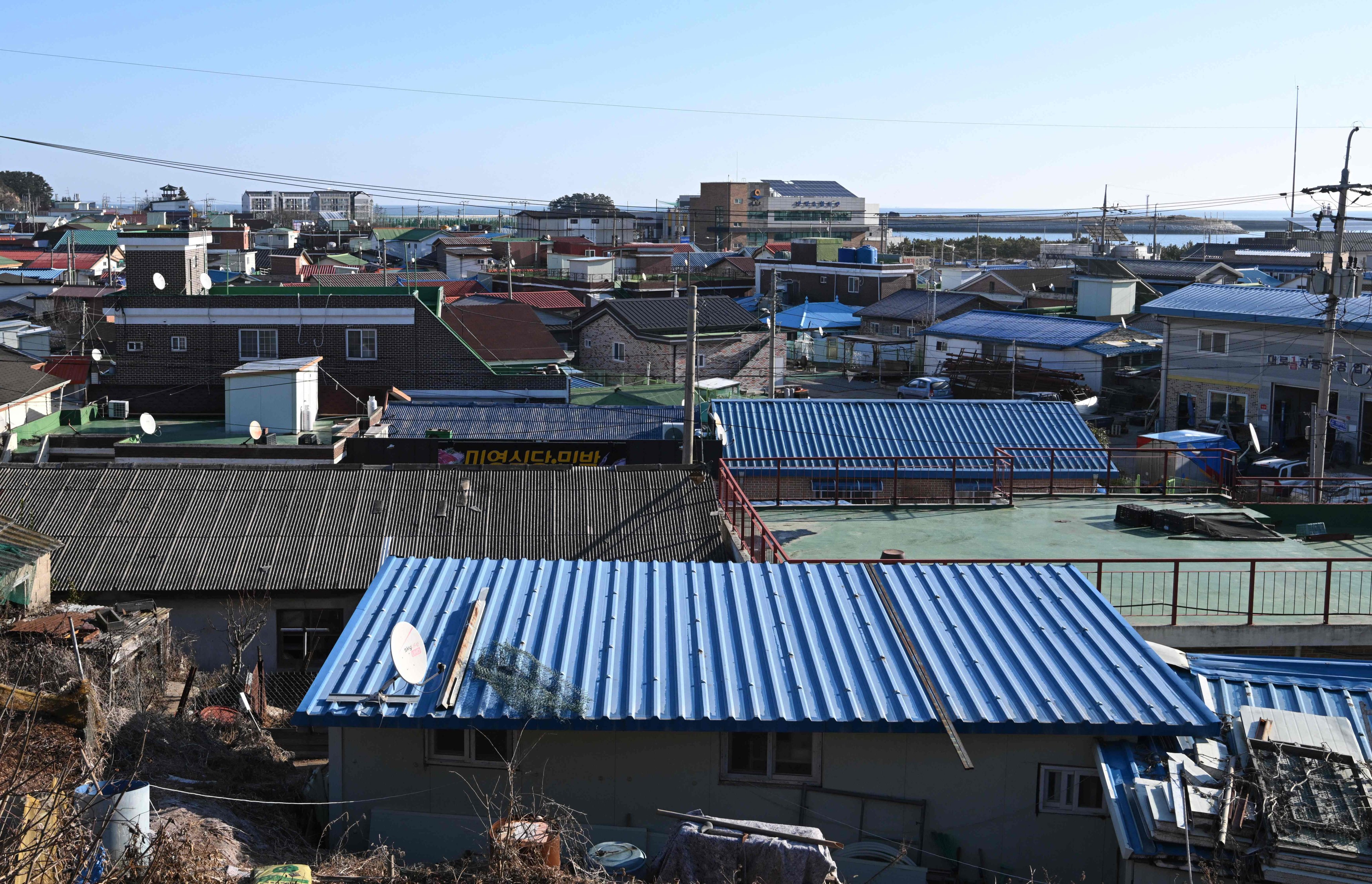 A village on Yeonpyeong island on Saturday. Yeonpyeong operates around 10 shelters across the island equipped with medical beds, children’s books and gas masks, among other materials. Photo: AFP