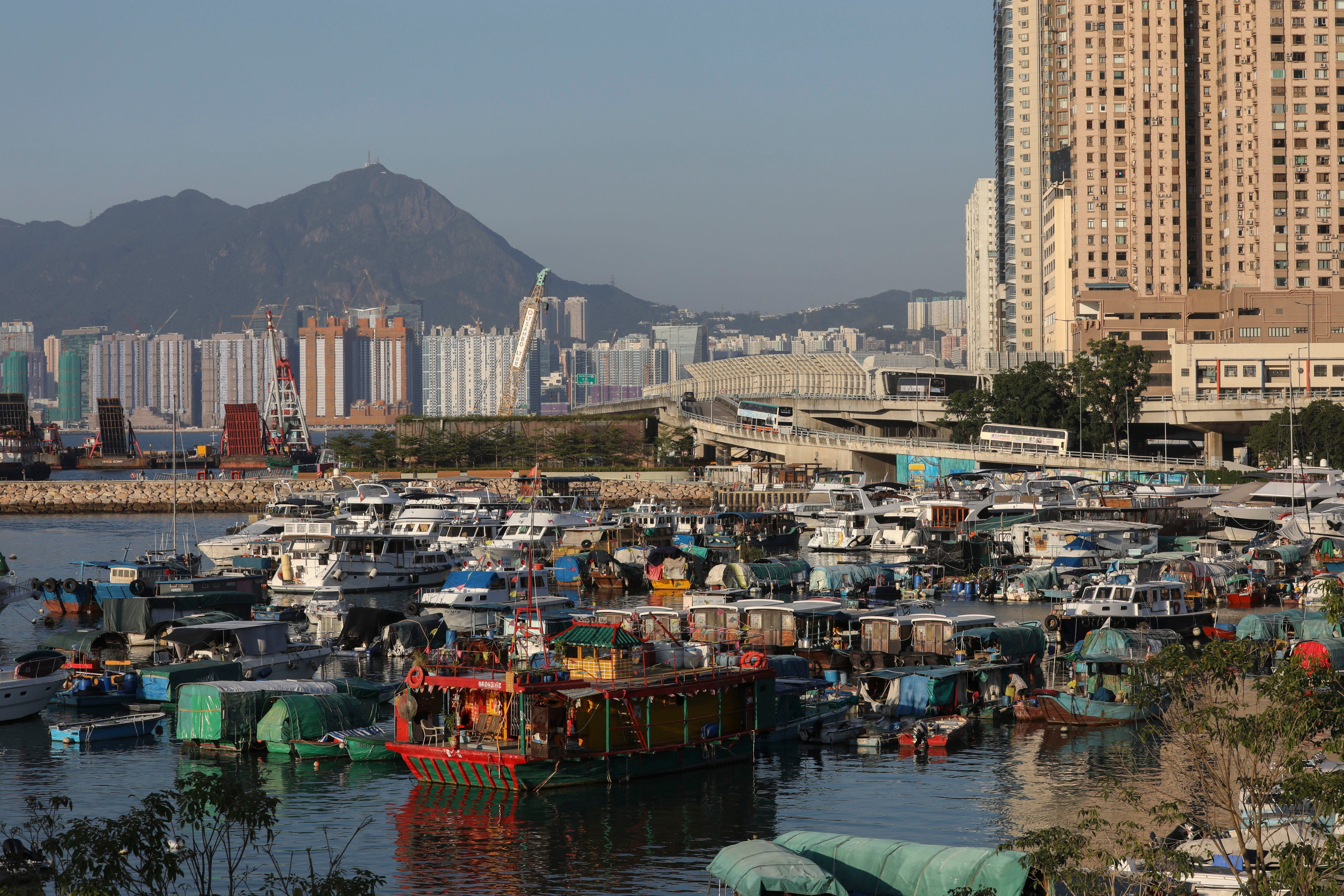 The floating Tin Hau temple (centre, foreground) in the Causeway Bay Typhoon Shelter against the backdrop of Kowloon (rear) and Tin Hau (right) on the north shore of Hong Kong Island. Photo: Antony Dickson