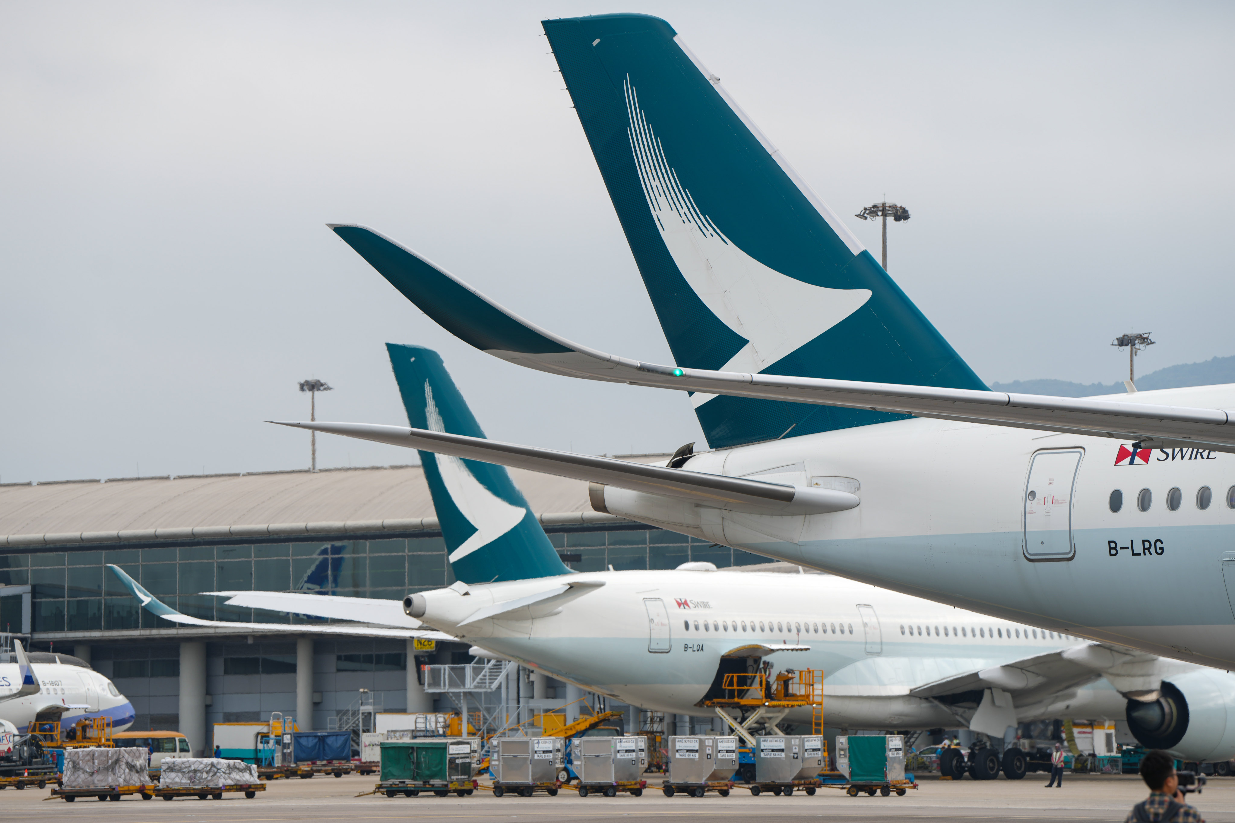 Cathay Pacific planes at Hong Kong International Airport. Some pilots have told the Post that flight cancellations may persist due to the shortage of experienced cockpit crew. Photo: Sam Tsang