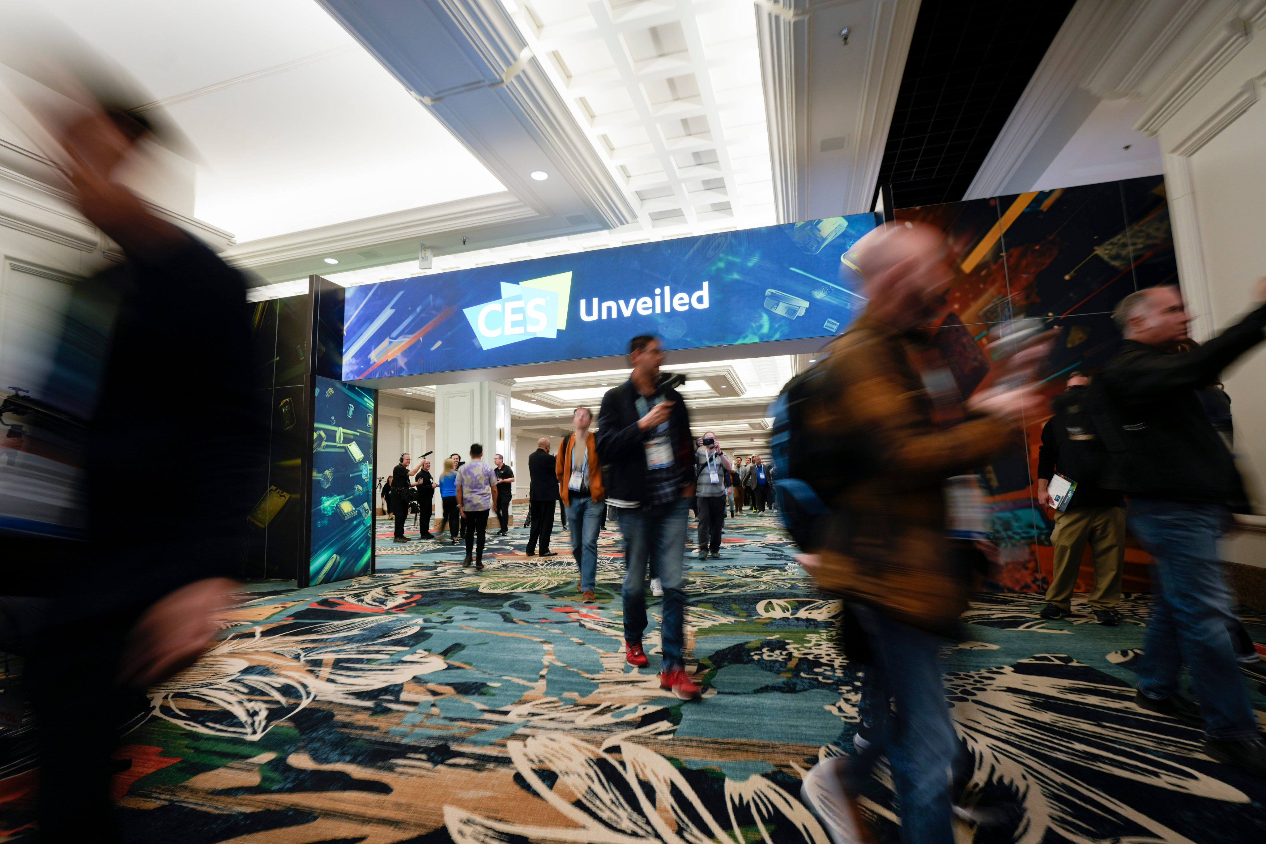 Attendees arrive at the CES Unveiled event before the start of the CES tech show, January 7, 2024, in Las Vegas. Photo: AP