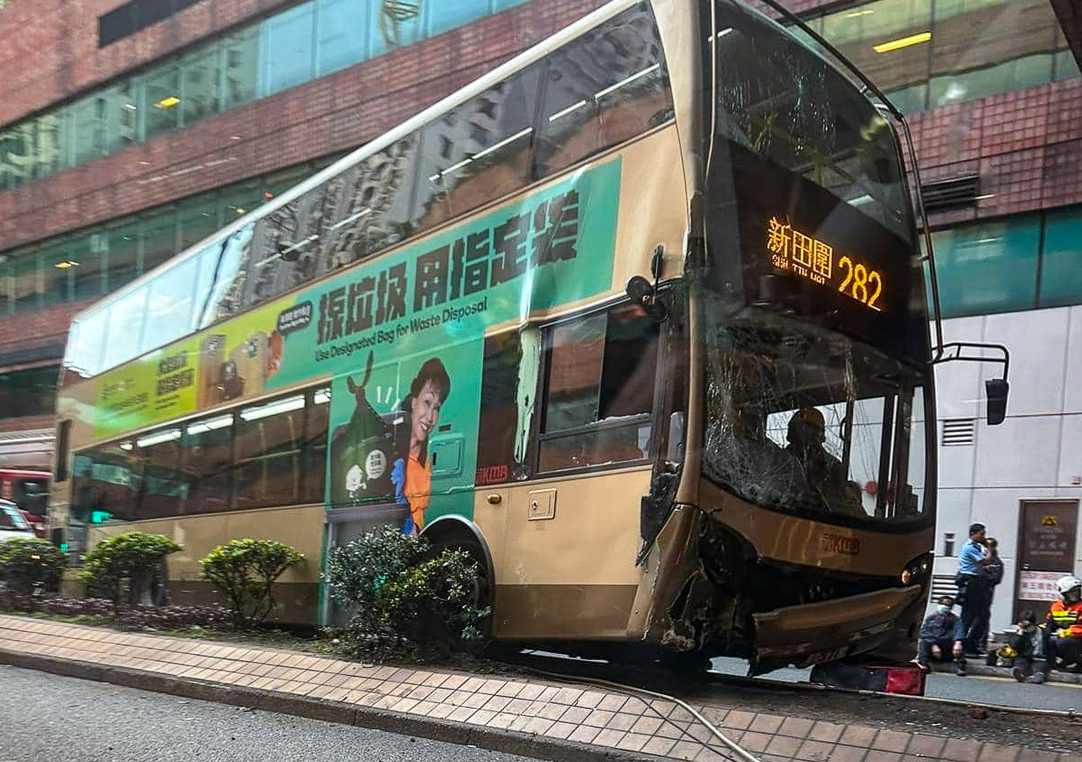 The KMB bus on the kerb after the crash. It was operating route 282, a circular service connecting Sha Tin’s New Town Plaza with Sun Tin Wai. Photo: Facebook/Akakin Li