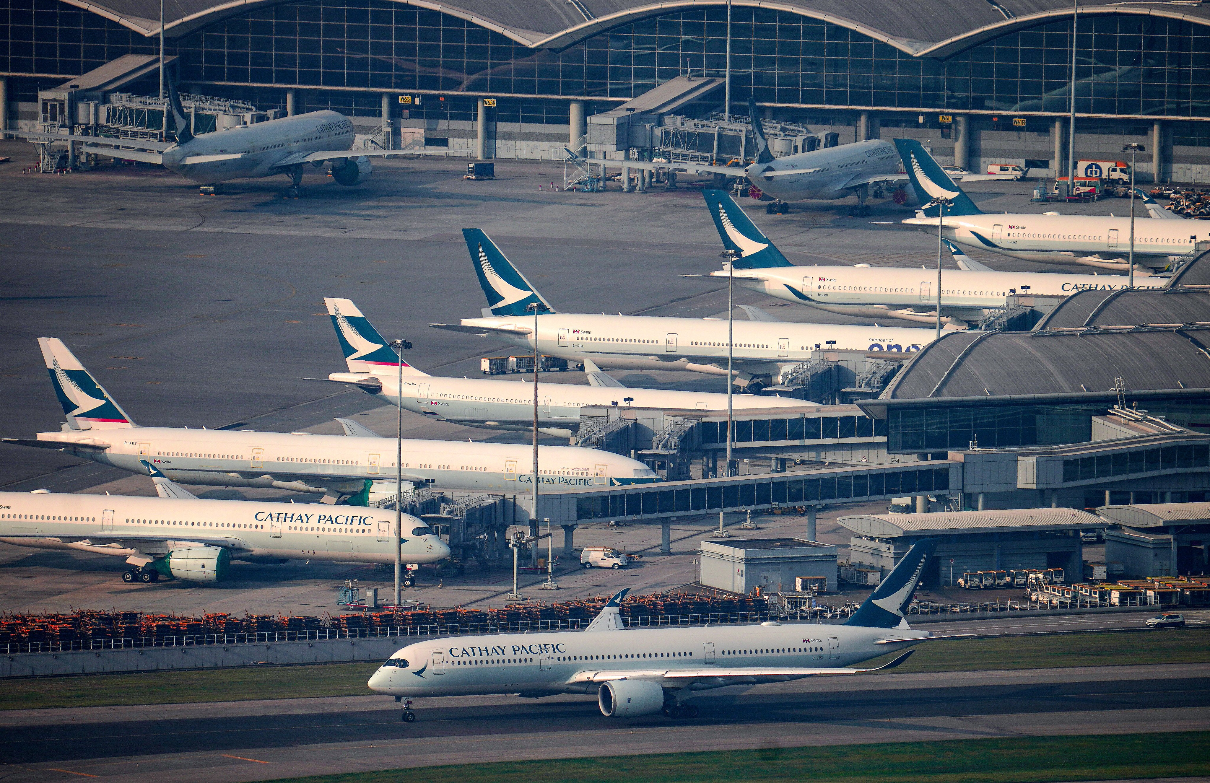 Cathay Pacific planes in Hong Kong. The carrier cancelled at least 21 flights on Tuesday, almost double the average of 12 a day it had a pledged. Photo: Sam Tsang
