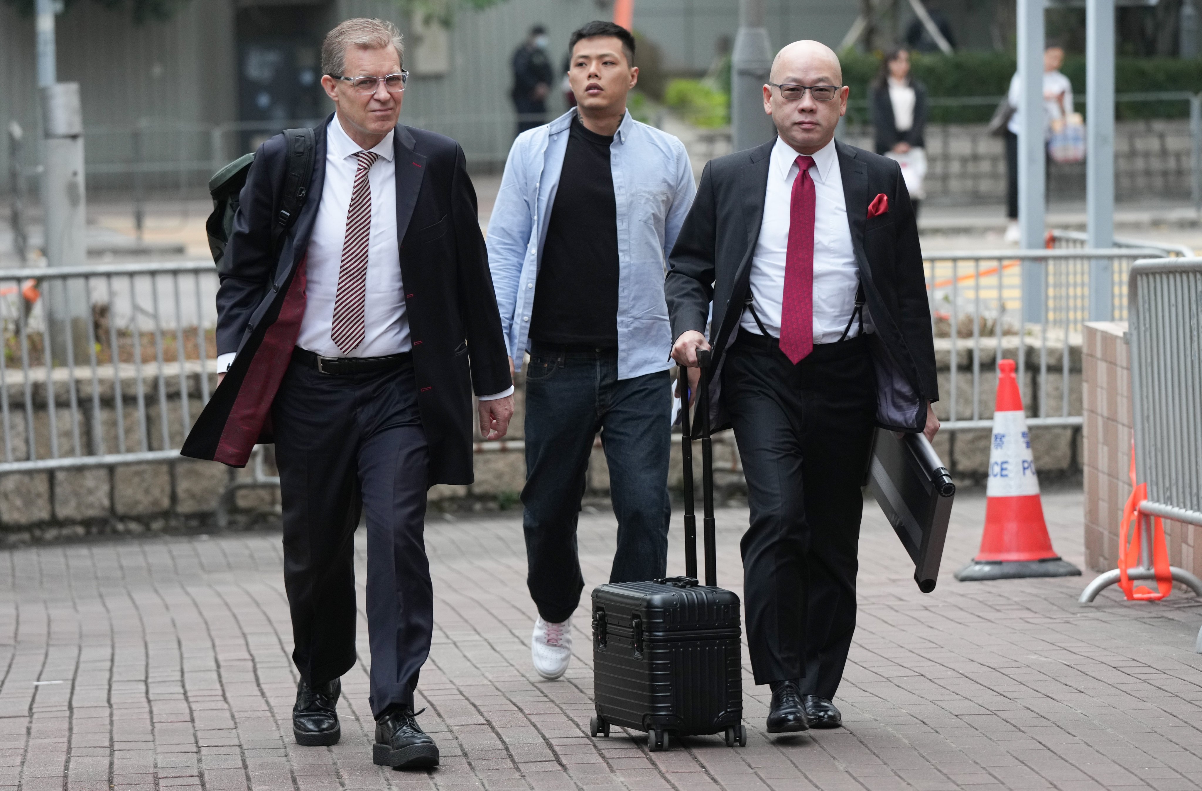 Jimmy Lai’s lawyers Robert Pang (right) and Marc Corlett head to court last week. Photo: Eugene Lee