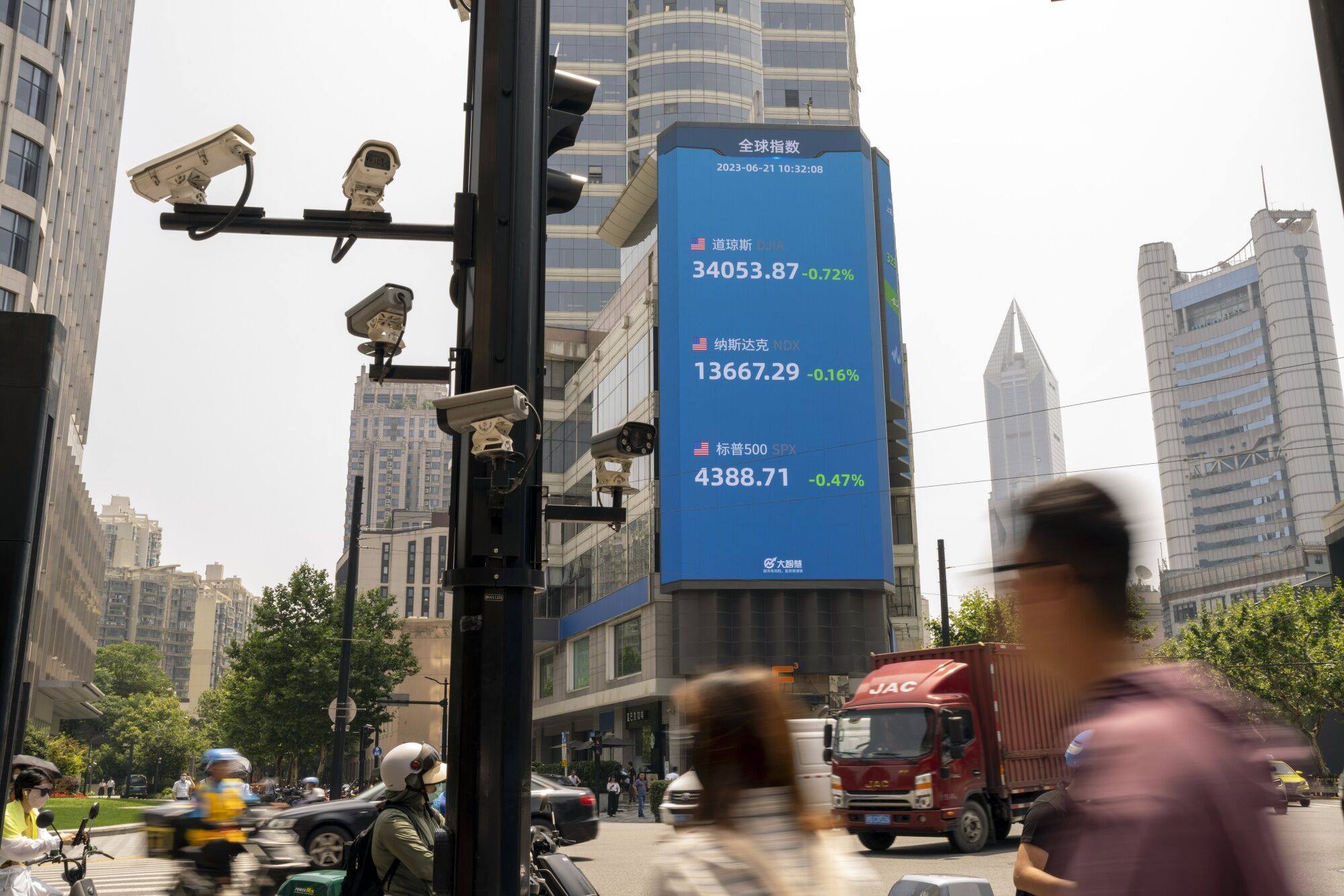 A public screen displaying stock figures in Pudong’s Lujiazui Financial District in Shanghai on June 21, 2023. Photo: Bloomberg
